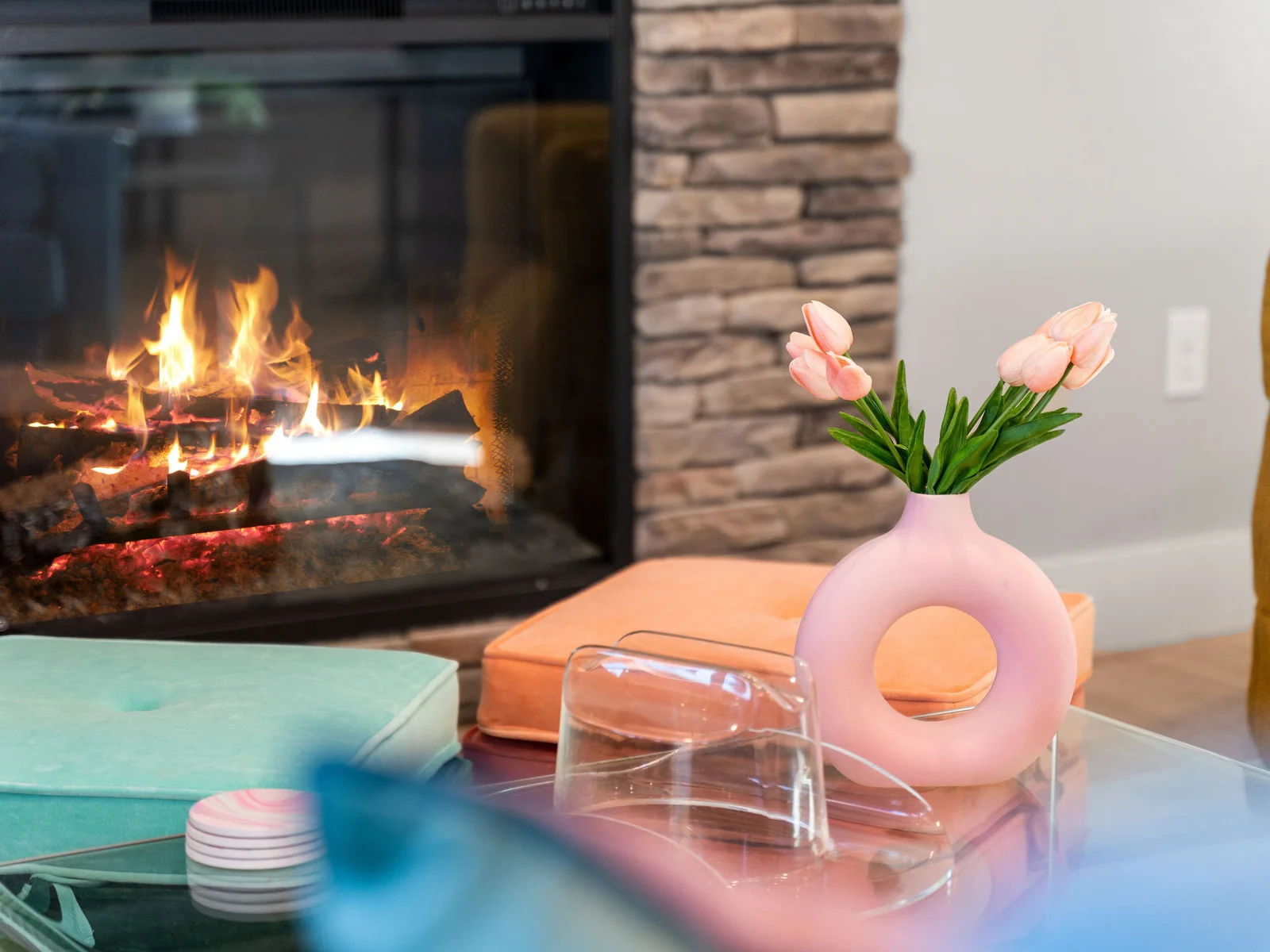 Living Room: Gather around the fire with stylish seating and vibrant decor for fun-filled evenings!