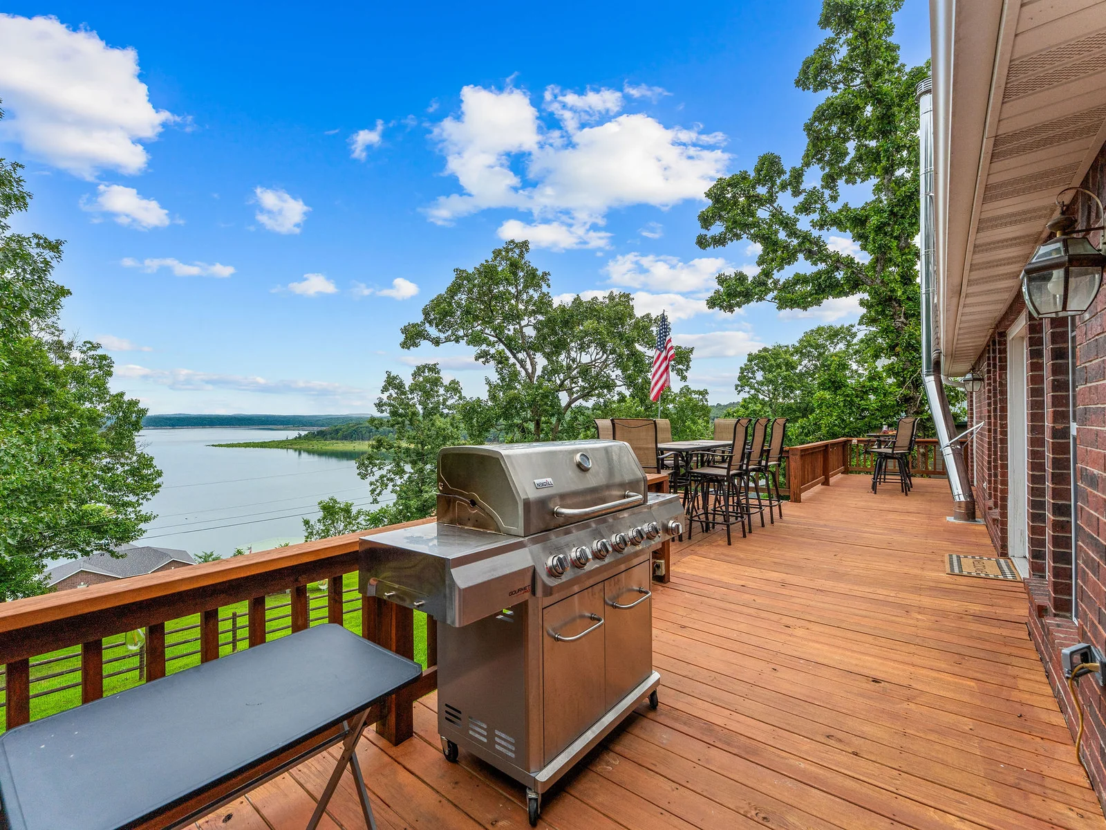 Grill on, lake view on, flag out — the upper deck has everything you need for an outdoor dinner that no restaurant in the area can match.