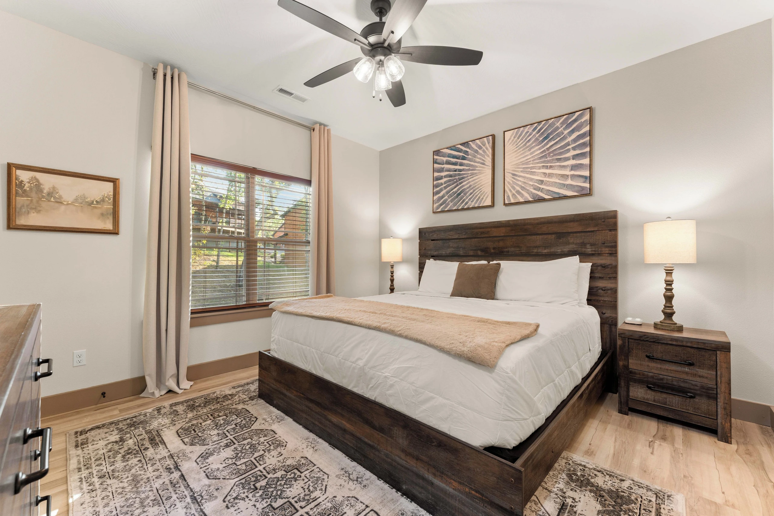 3rd Bedroom with a king bed, upstairs. Blackout curtains, sound machine, ceiling fan and ensuite.