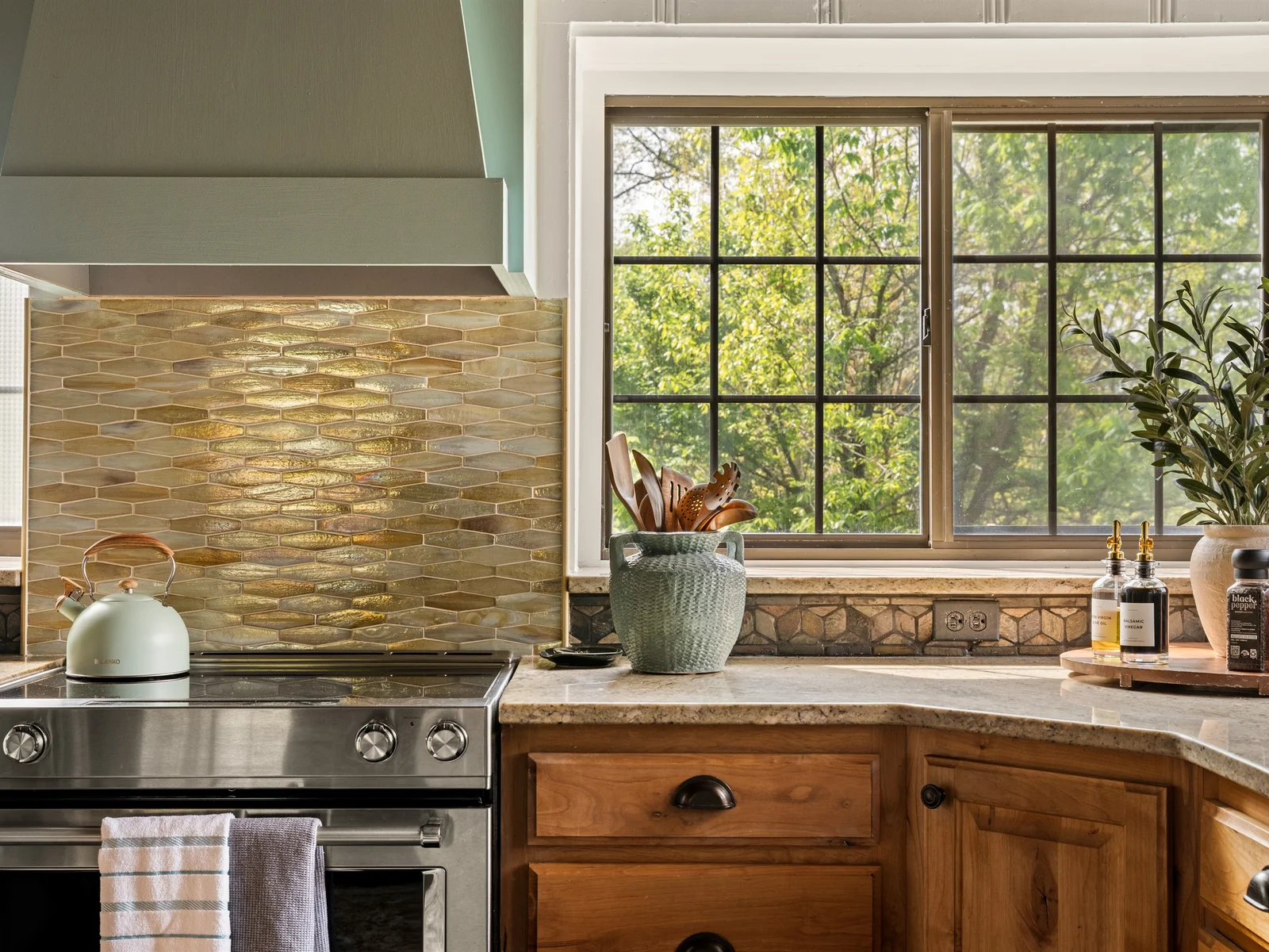 Beautiful finishes and warm tones bring character to this inviting kitchen.