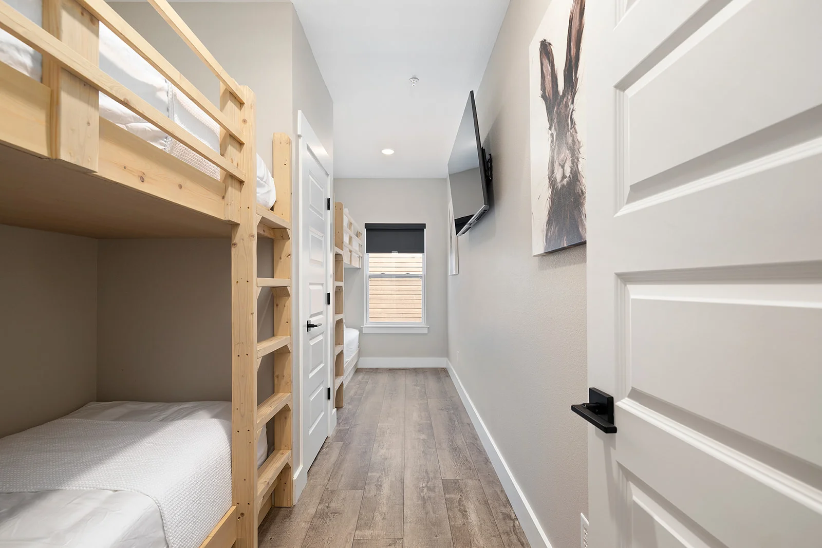 Main level bunk room with 4 twin beds