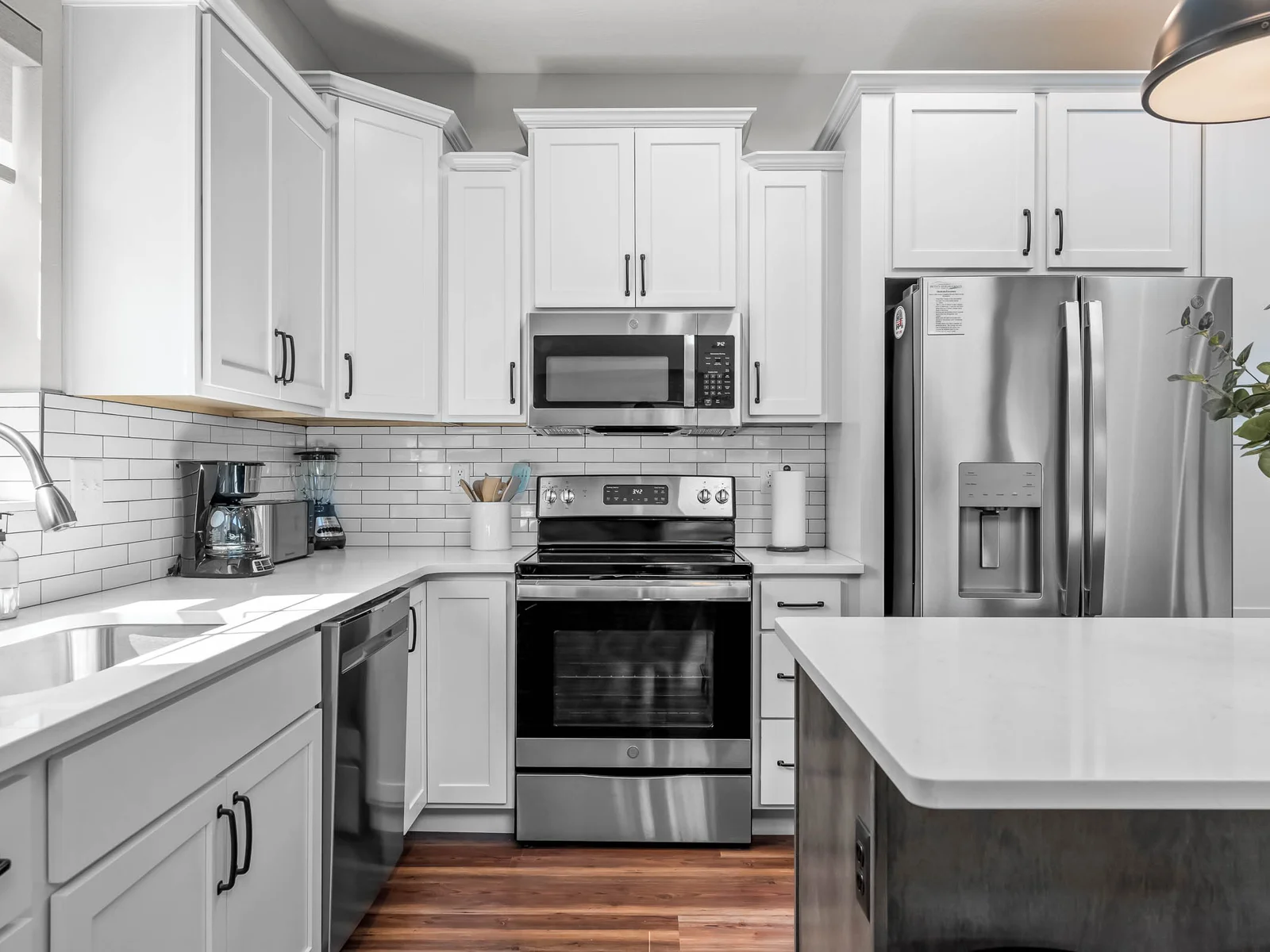 Stainless appliances with lovely cabinets