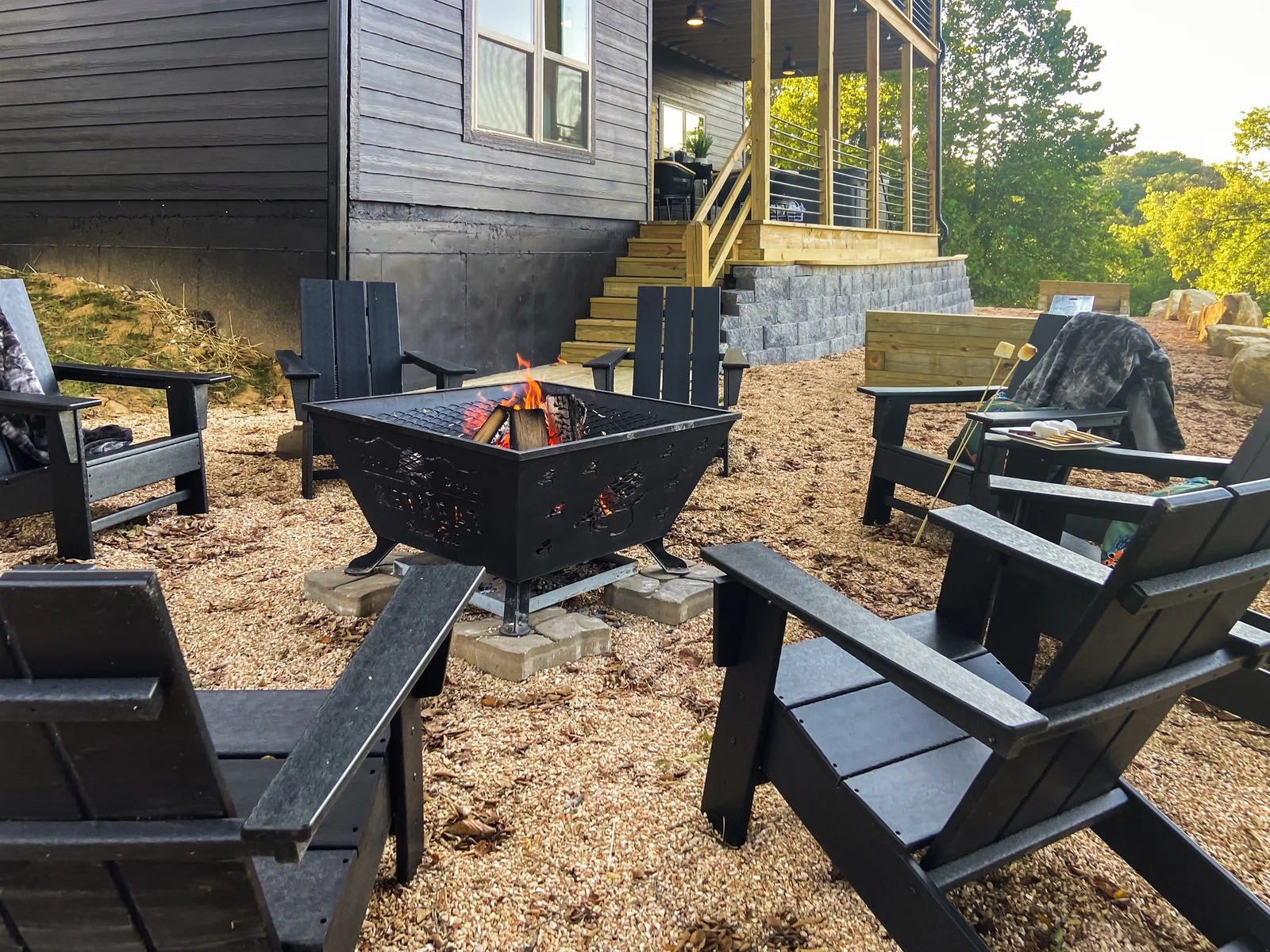 Lower deck stairs lead to the firepit and horseshoe area