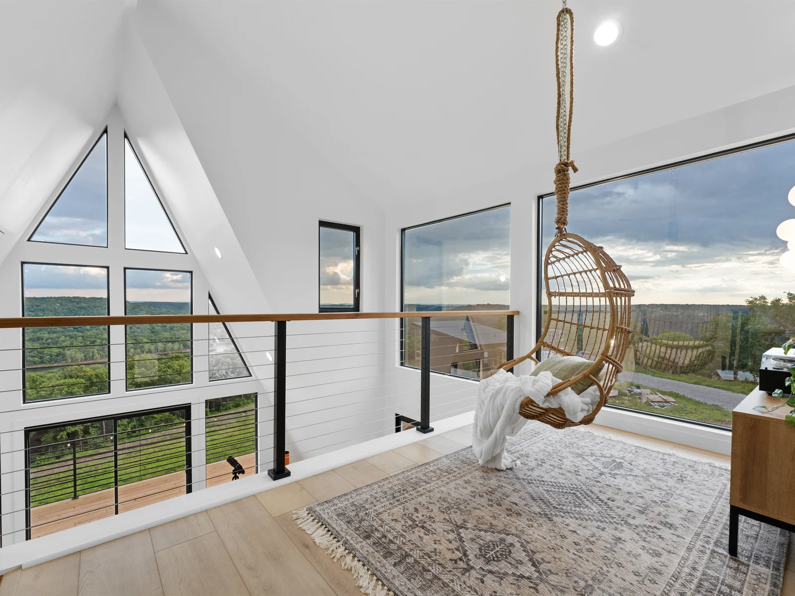 Cozy loft vibes, scenic views & a swing to match
