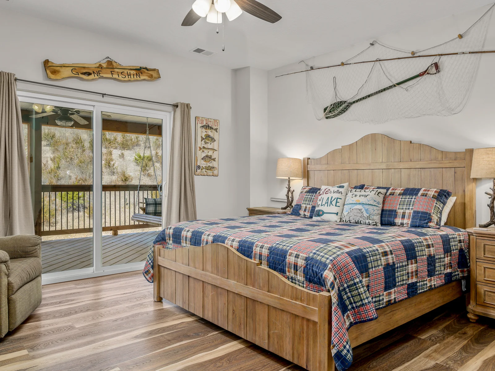 Upper level: Bright River room with King bed, recliner, private deck with cedar swing, and ensuite bathroom