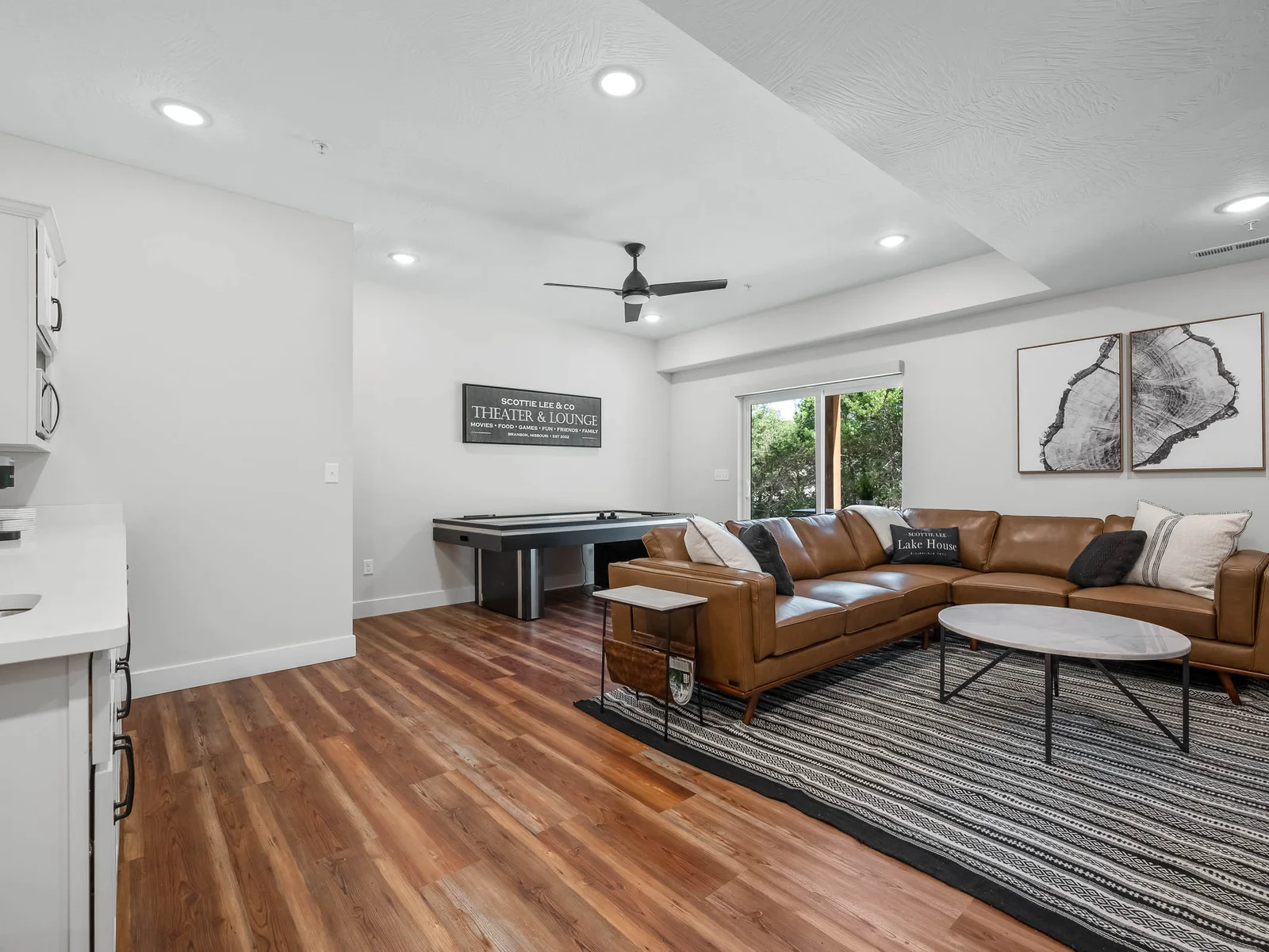Lower living, wetbar, and air hockey table