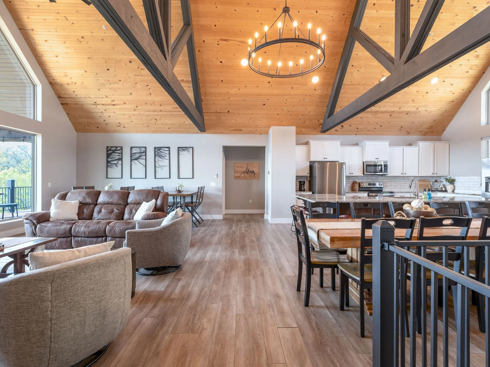 Open concept living room with tons of seating and space + a great view!