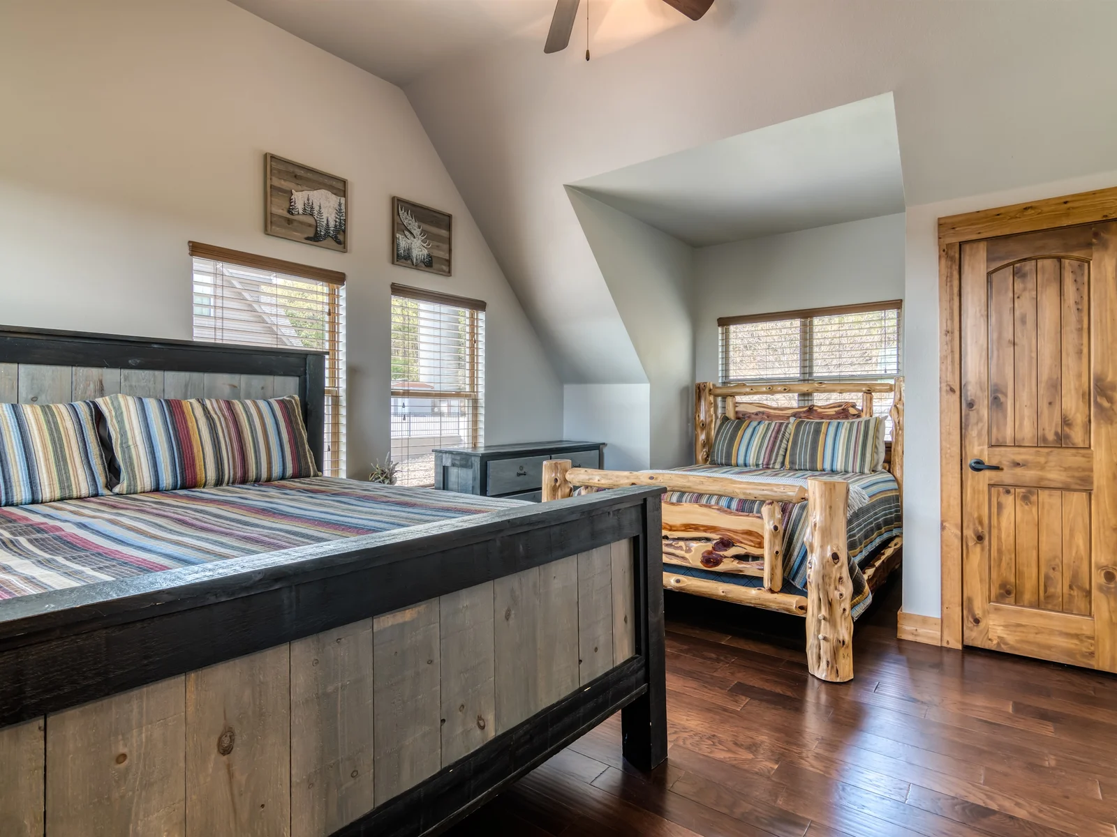 The two upper bedrooms each have King and a Queen bed in each room!