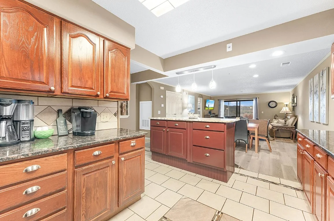 Open kitchen layout with coffee maker and full cooking setup.