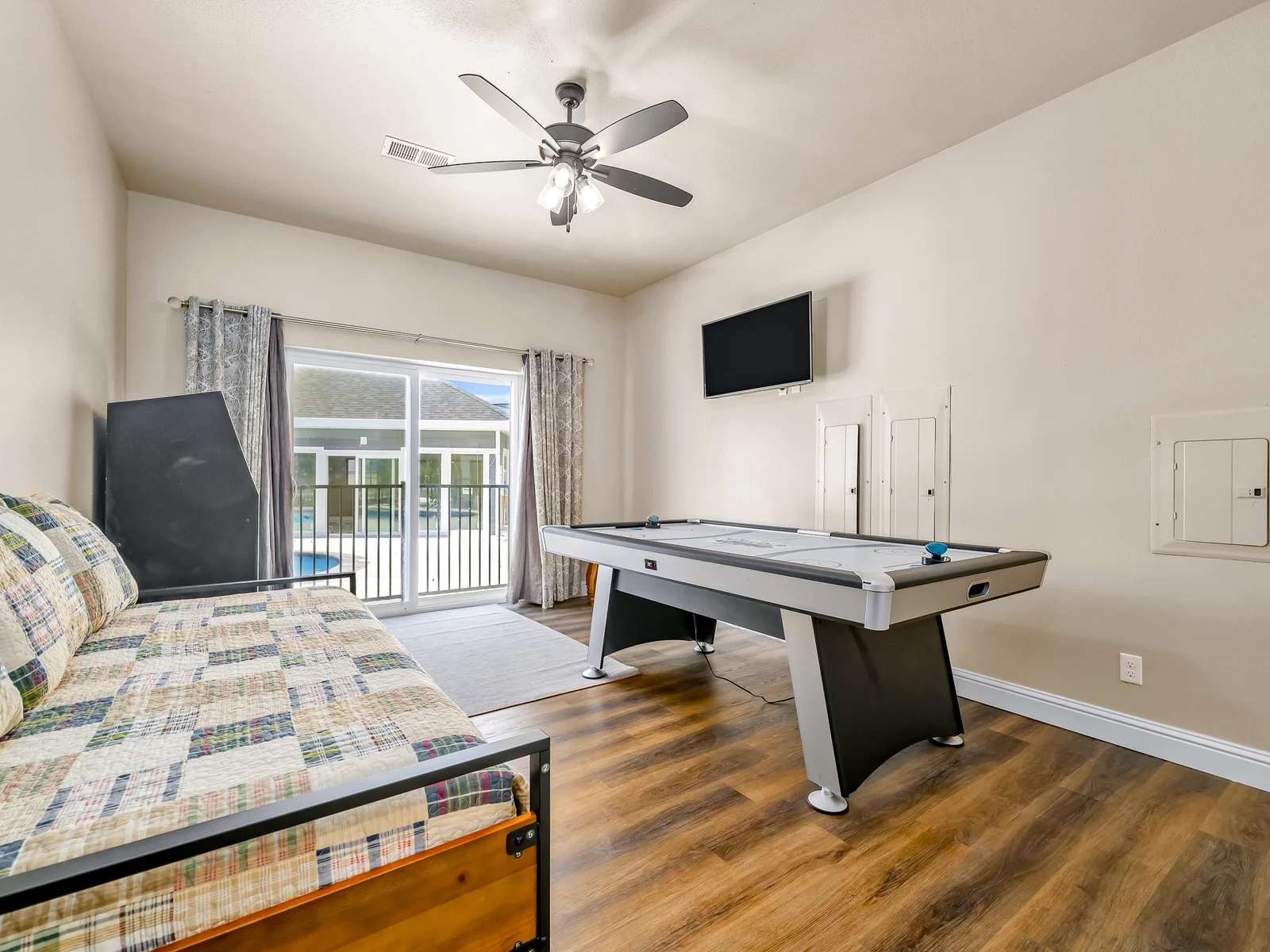 Main level daybed with Trundle. An arcade game and air hockey table will be so much fun for kiddos! There are a total of 4 stairs to navigate down to reach this bedroom.