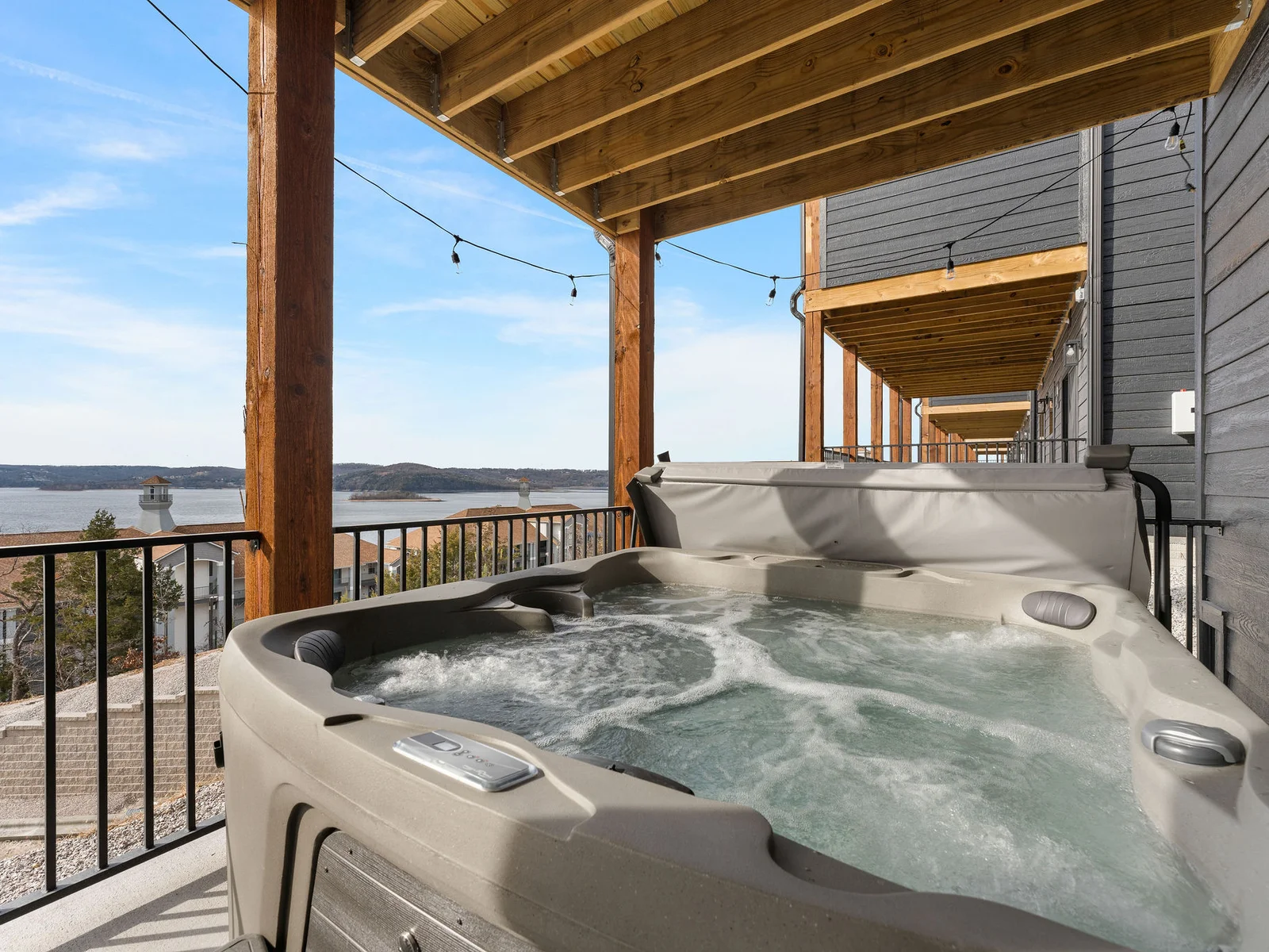 Soak in the hot tub while looking over the lake!