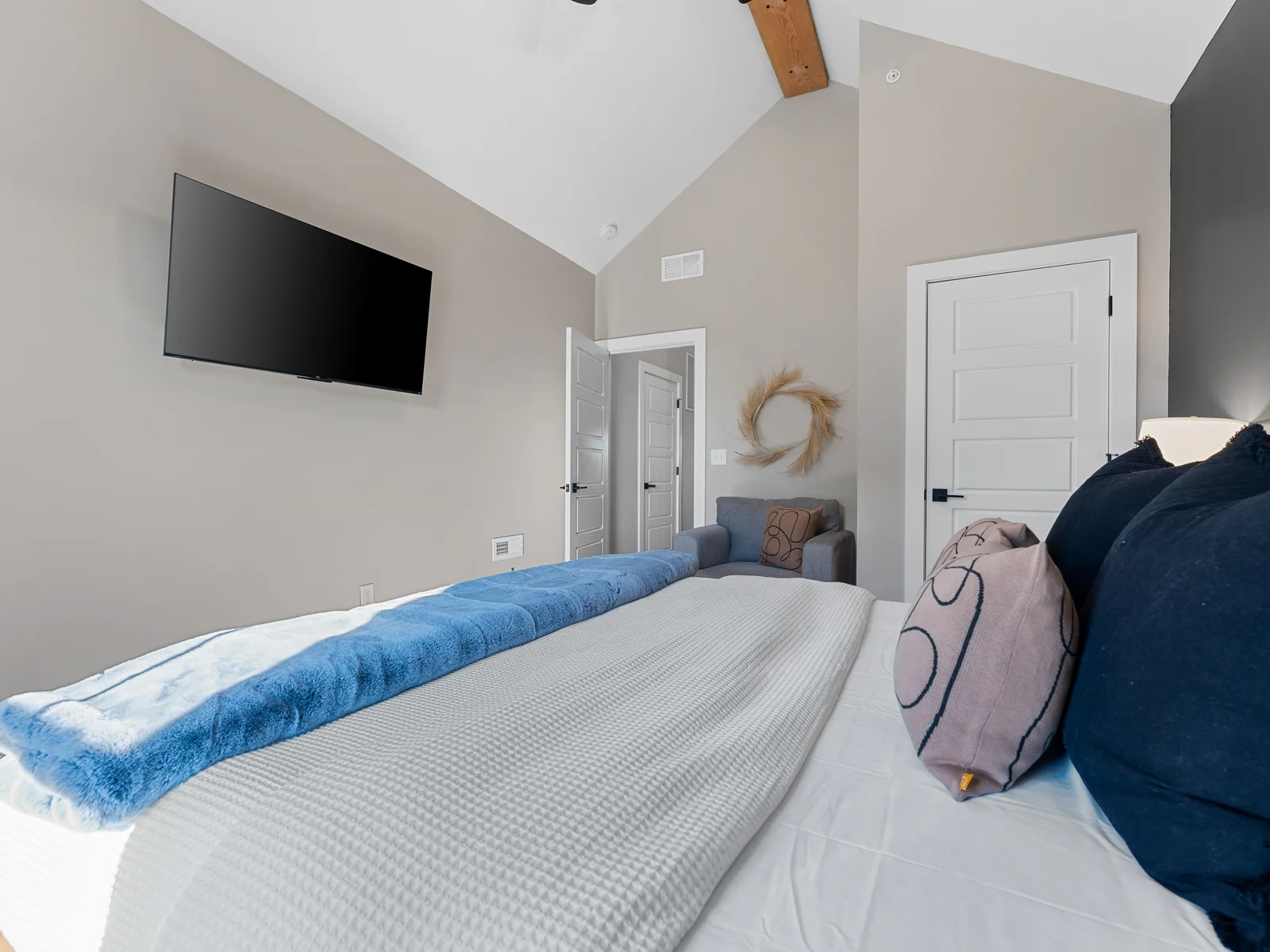 Bedroom Retreat: Enjoy cinematic bliss on a large smart TV while relaxing in stylish comfort!