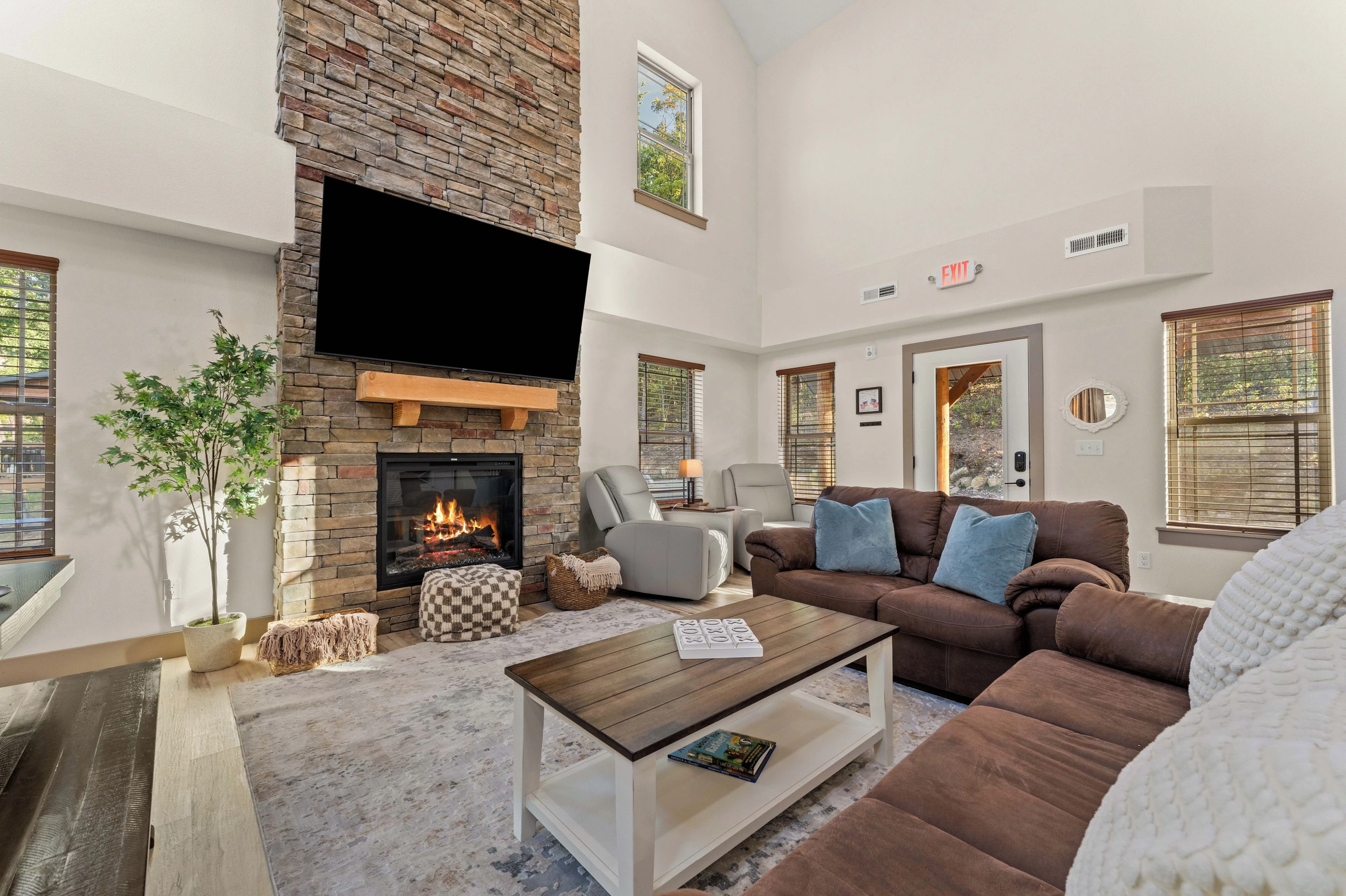 View towards front entrance with two electric recliners in the corner.