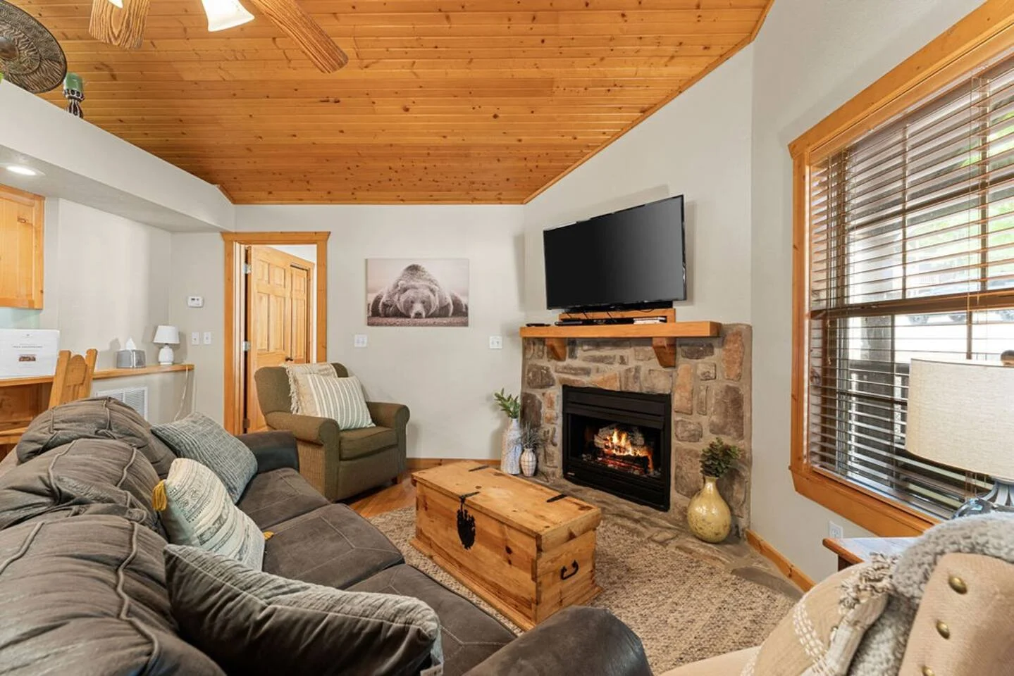 Plenty of comfortable seating to enjoy the electric fireplace and watch the big game on the flat-screen TV.