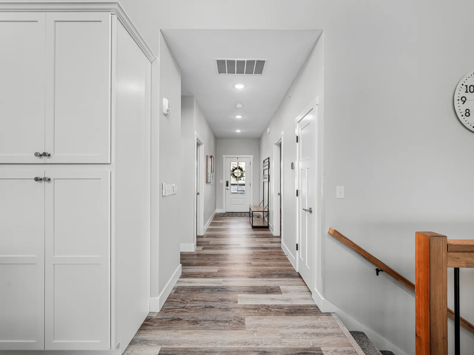 Entry hall leads to two bedrooms and the laundry room.