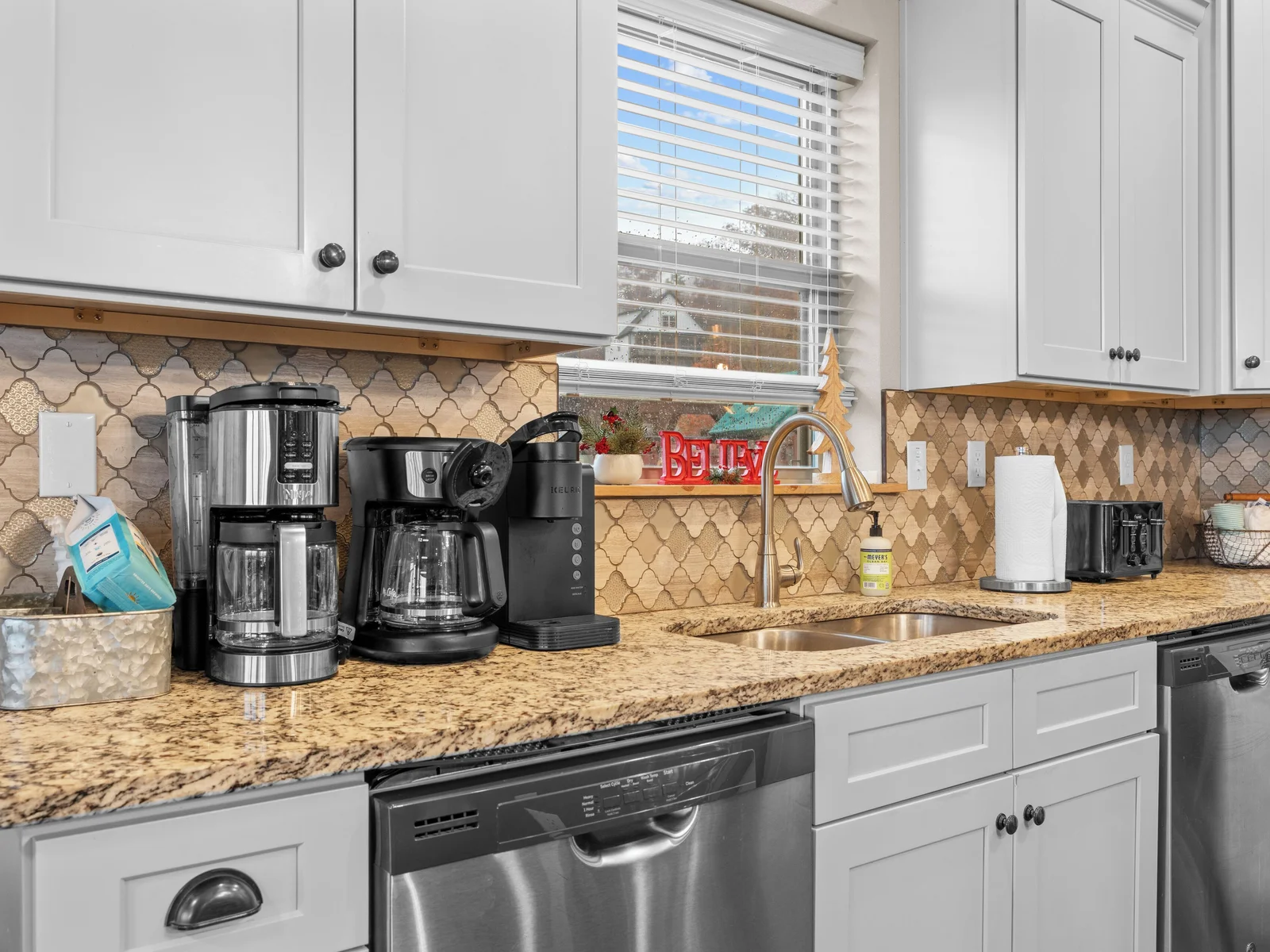 Main level kitchen. Two full-size refrigerators, two dishwashers, oven/ceramic glass cooktop, microwave, drip coffee maker, Keurig, and Nespresso. Stocked with small appliances, cookware, bakeware, utensils, dishes, glassware, mugs, and more!