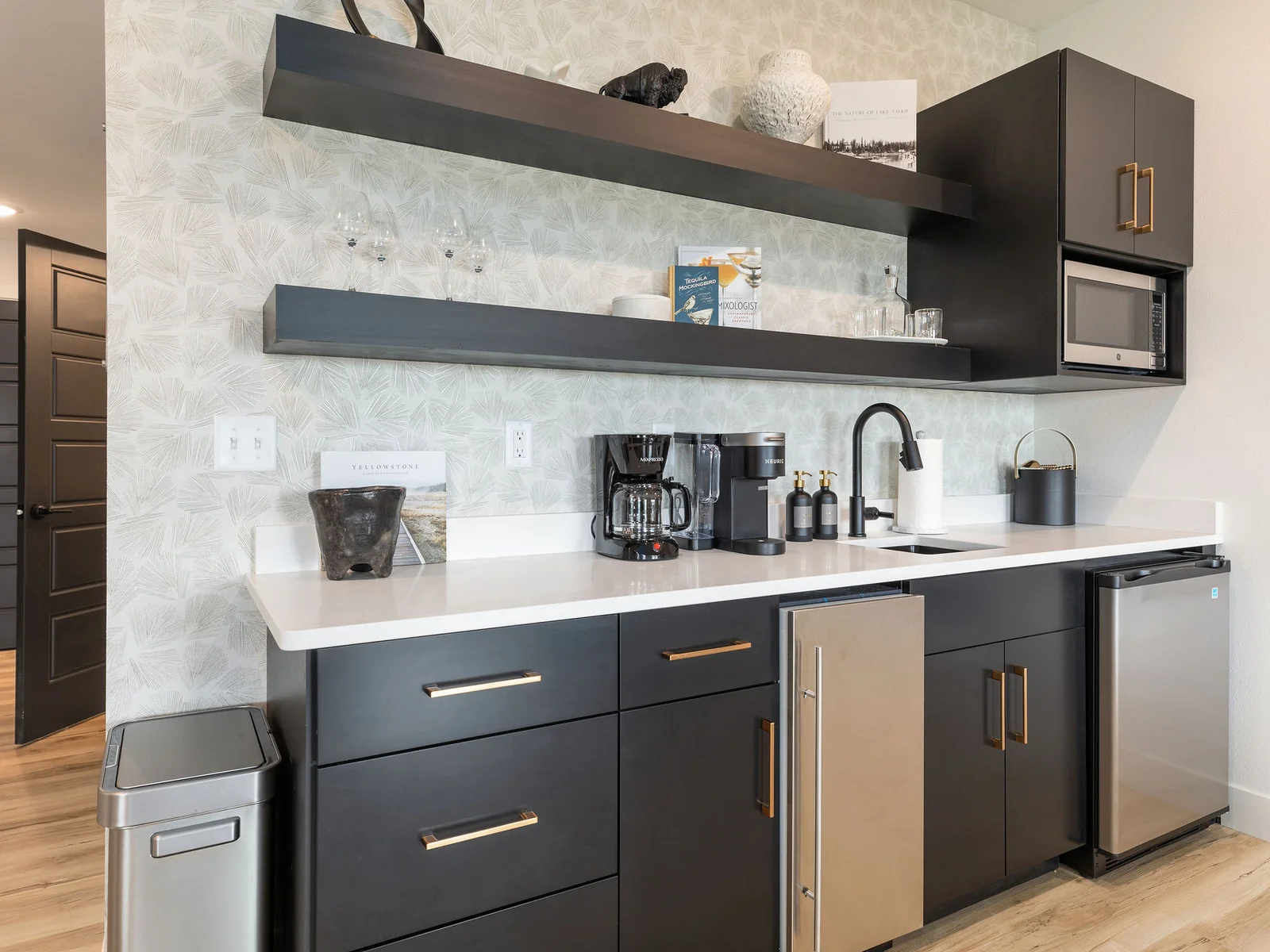 Lower level wet bar with mini fridge and ice machine