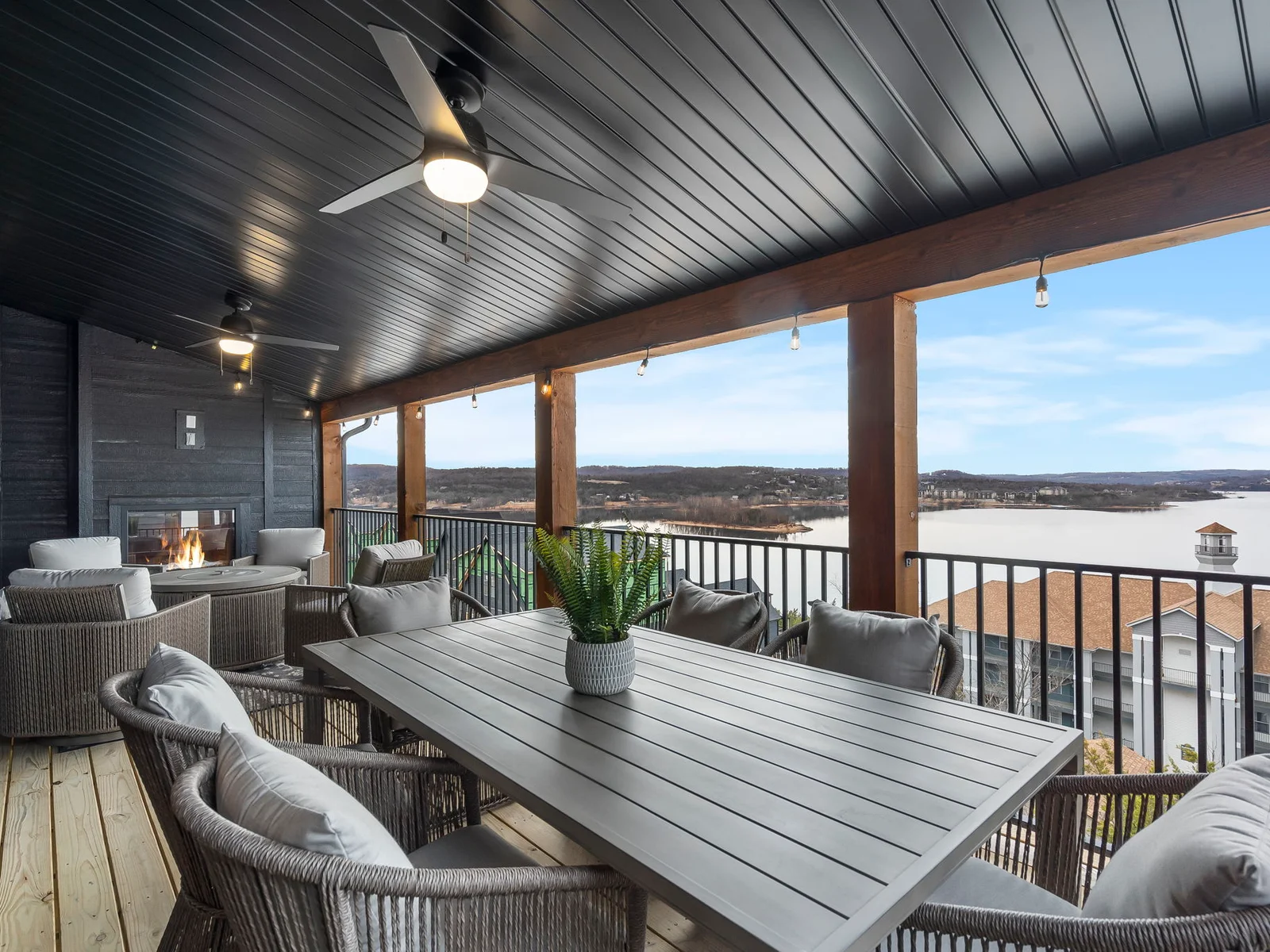 Main level deck with electric fireplace and propane grill