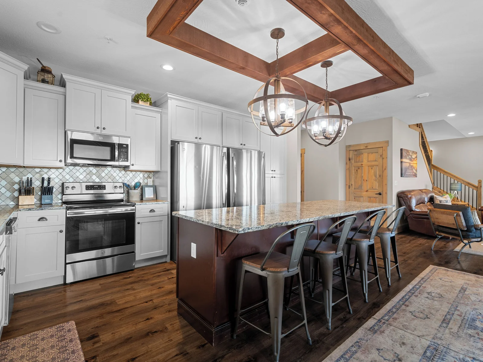 Main level kitchen. Two full-size refrigerators, two dishwashers, oven/ceramic glass cooktop, microwave, drip coffee maker, Keurig, and Nespresso. Stocked with small appliances, cookware, bakeware, utensils, dishes, glassware, mugs, and more!
