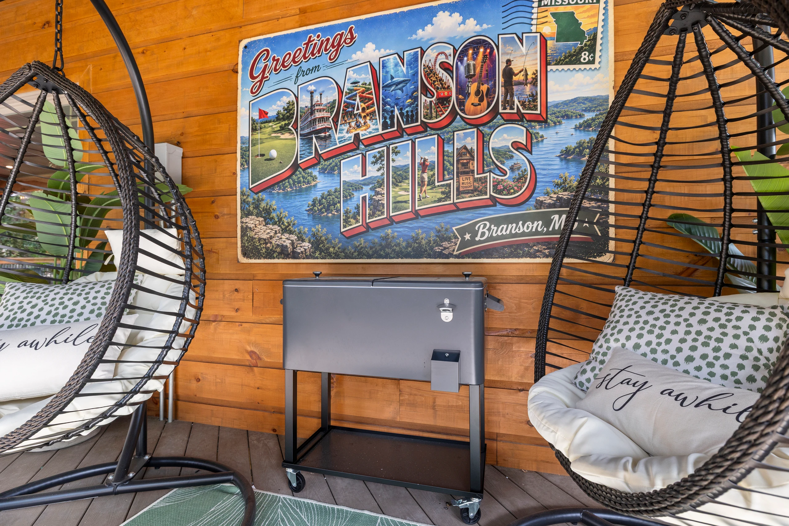 An egg chair, a drink fridge, and postcard art - the hangout corner.