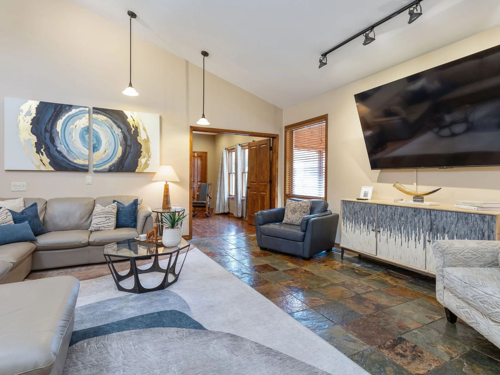 Upper level living room with huge TV to watch movies with the family!