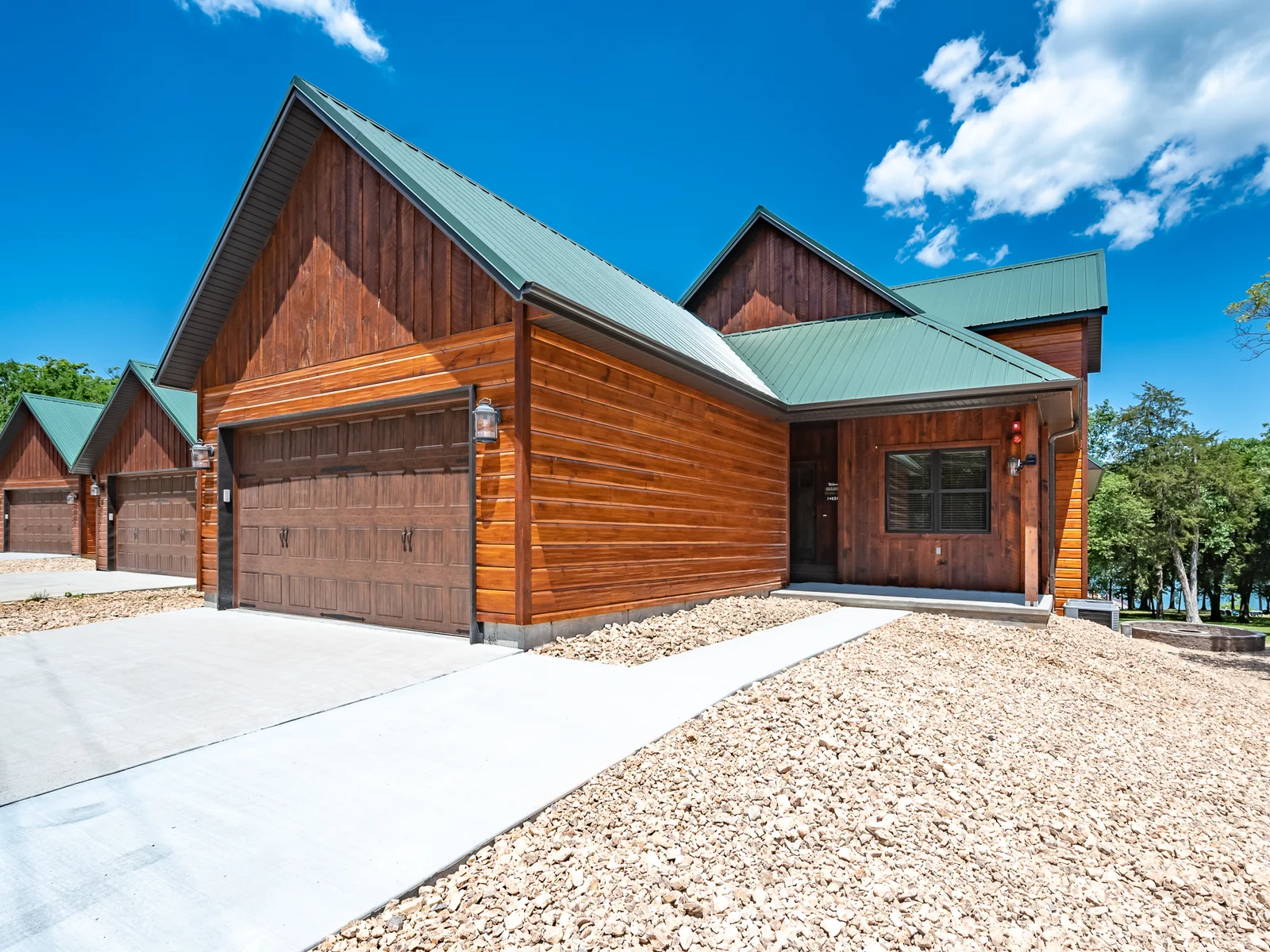 Make yourself at home in this spectacular lodge with private garage only steps from the dock
