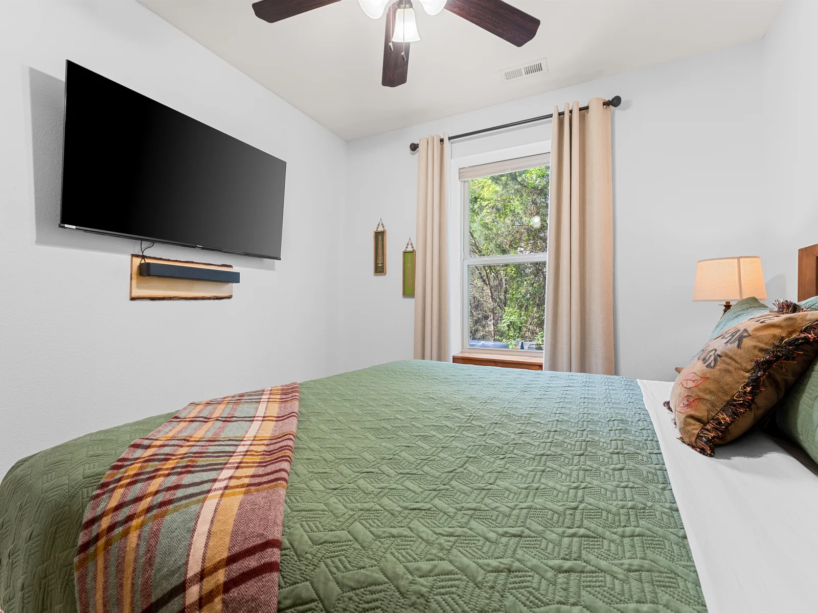 Right in the middle of the fun, this room features a king bed with a mounted TV.