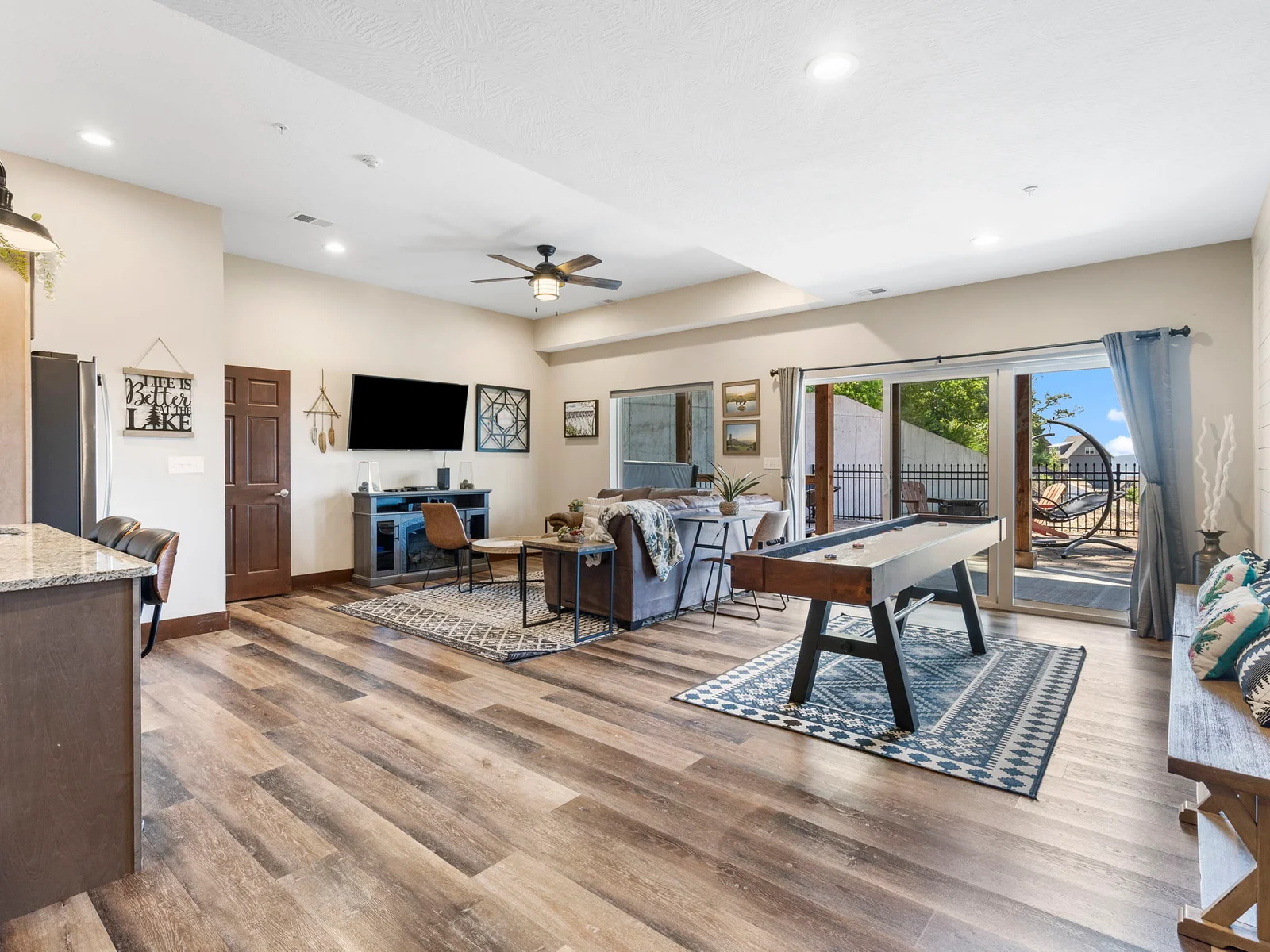 Lower level living room with PS4 and shuffleboard table