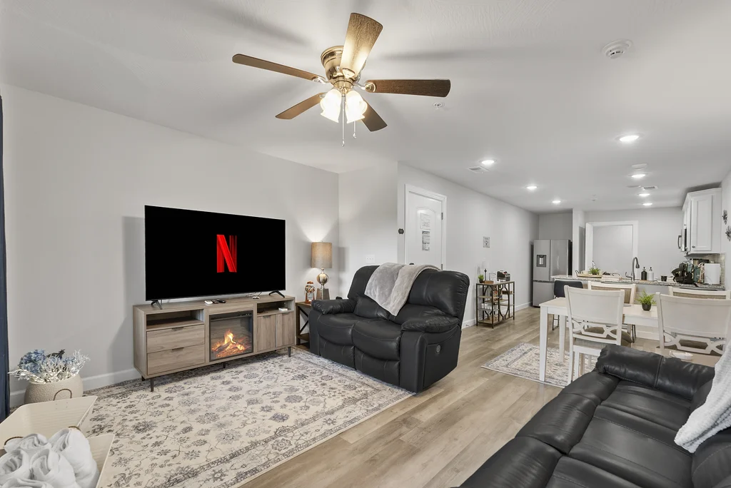 Open Living Room with comfortable sofas, fireplace, TV