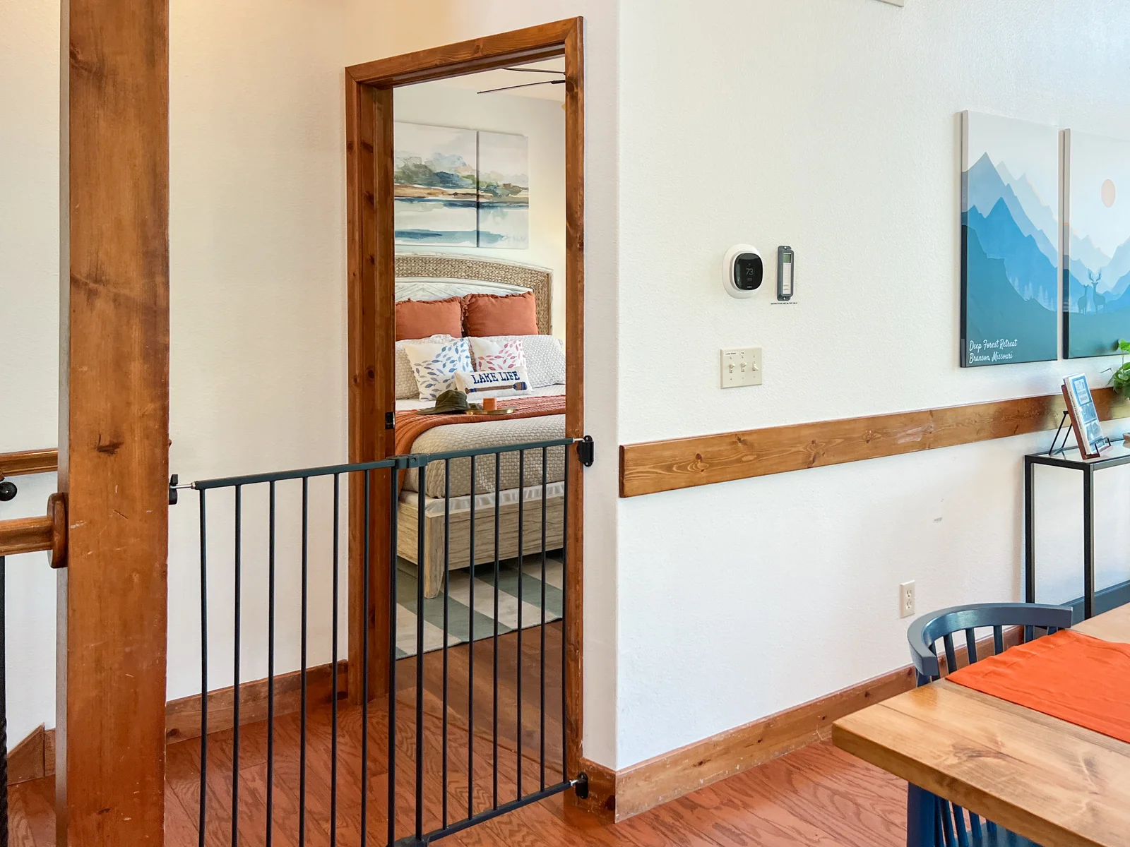 We can set up the baby gate for those needing to block the stairs down. And off the main living room is another master bedroom.