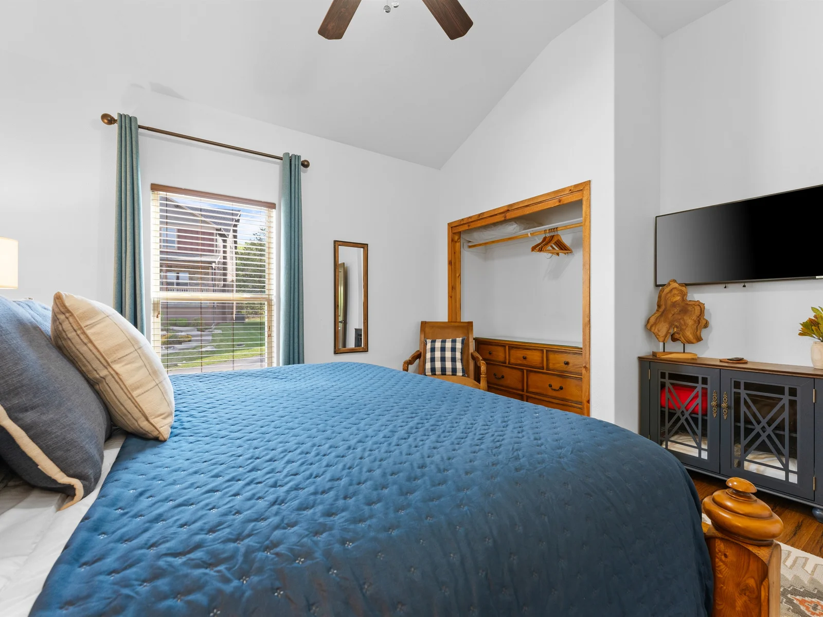 Plenty of space to relax in this calming blue room.