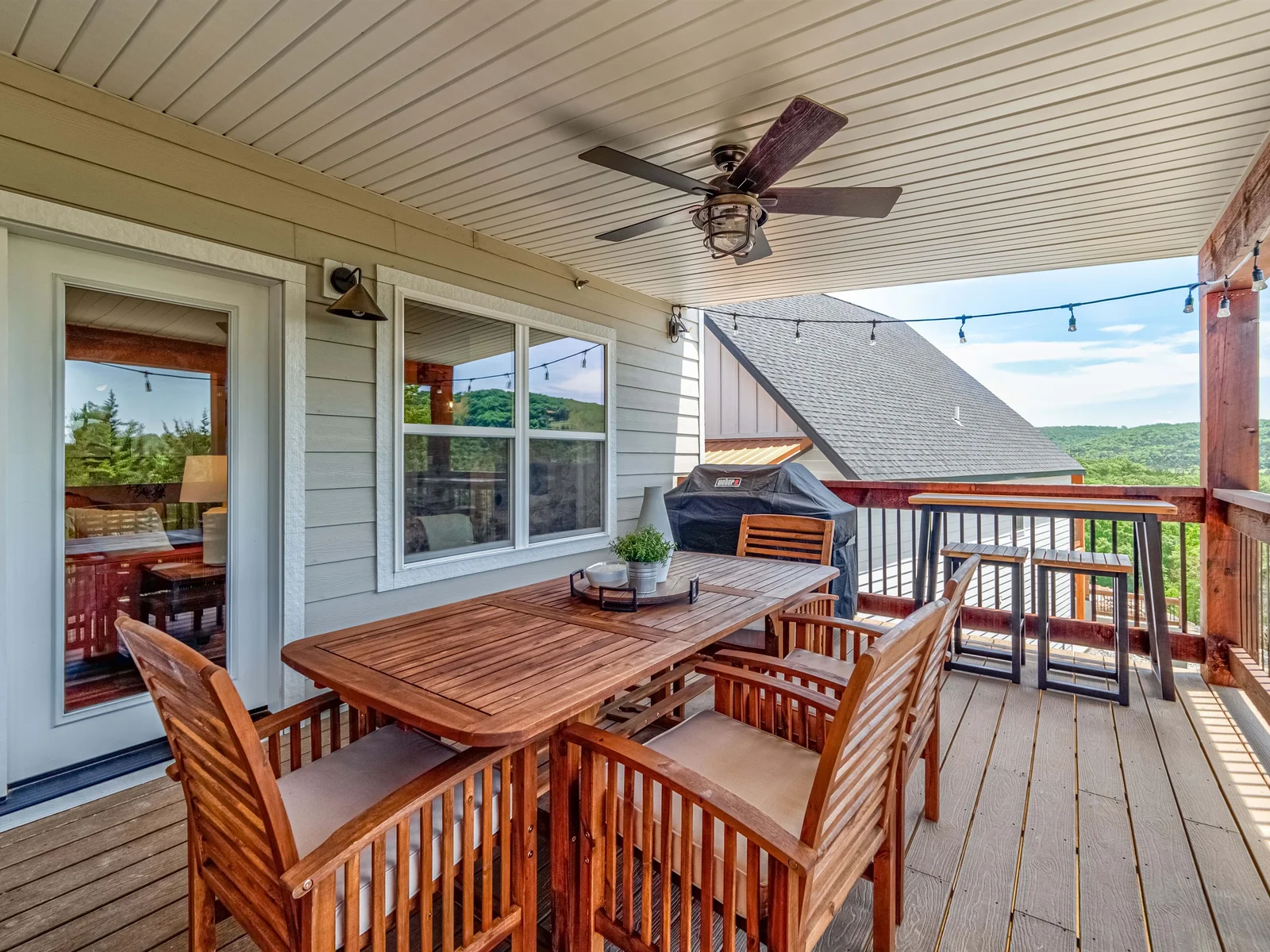 Outdoor dining with a forrested lake view