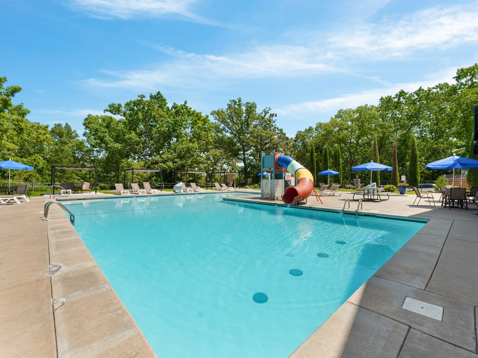 Outdoor Oasis: Splash into fun at the inviting pool with a thrilling waterslide and sun loungers!