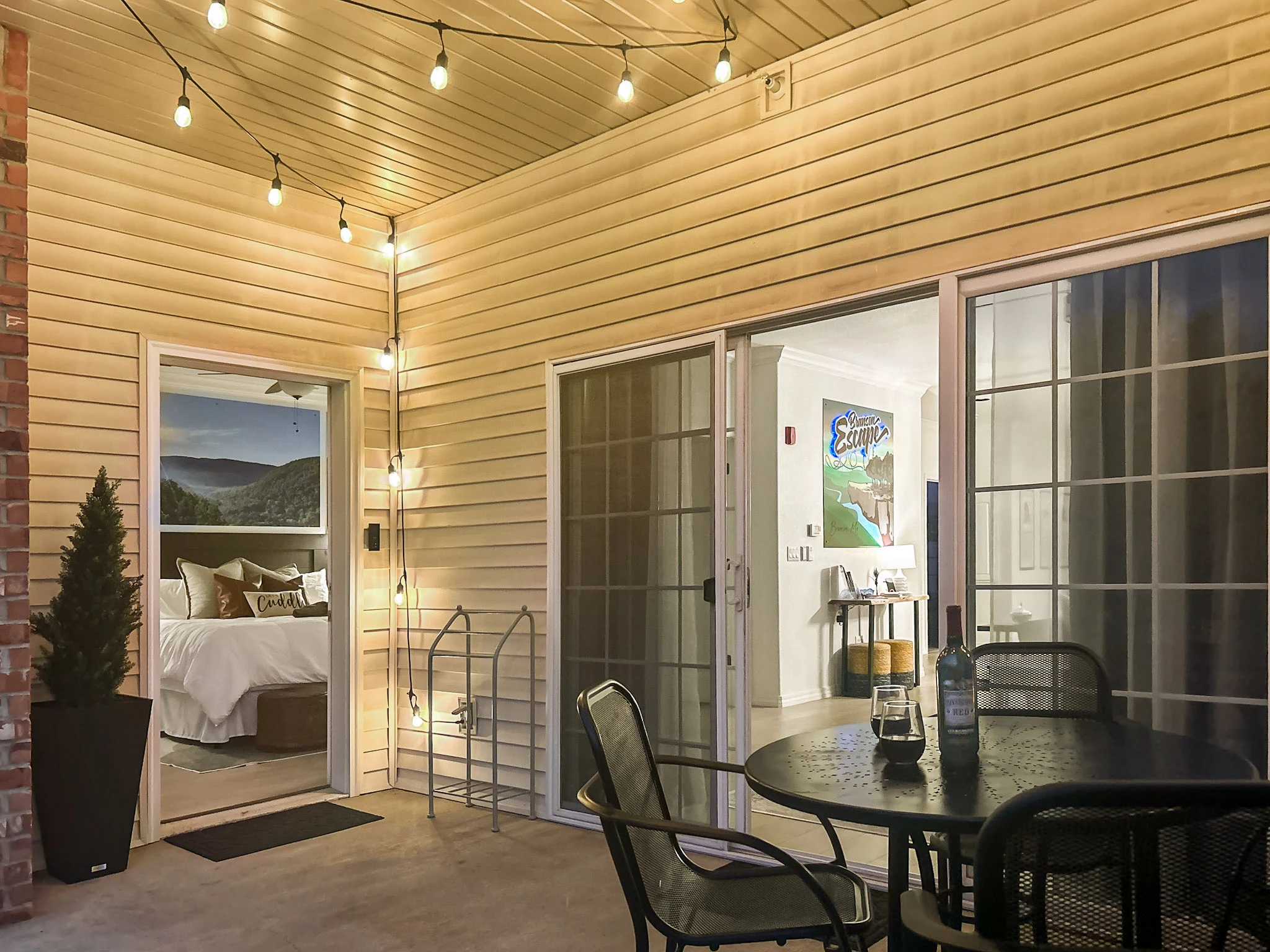 Once the sun goes down, cafe lights add a little magic to the backyard patio.