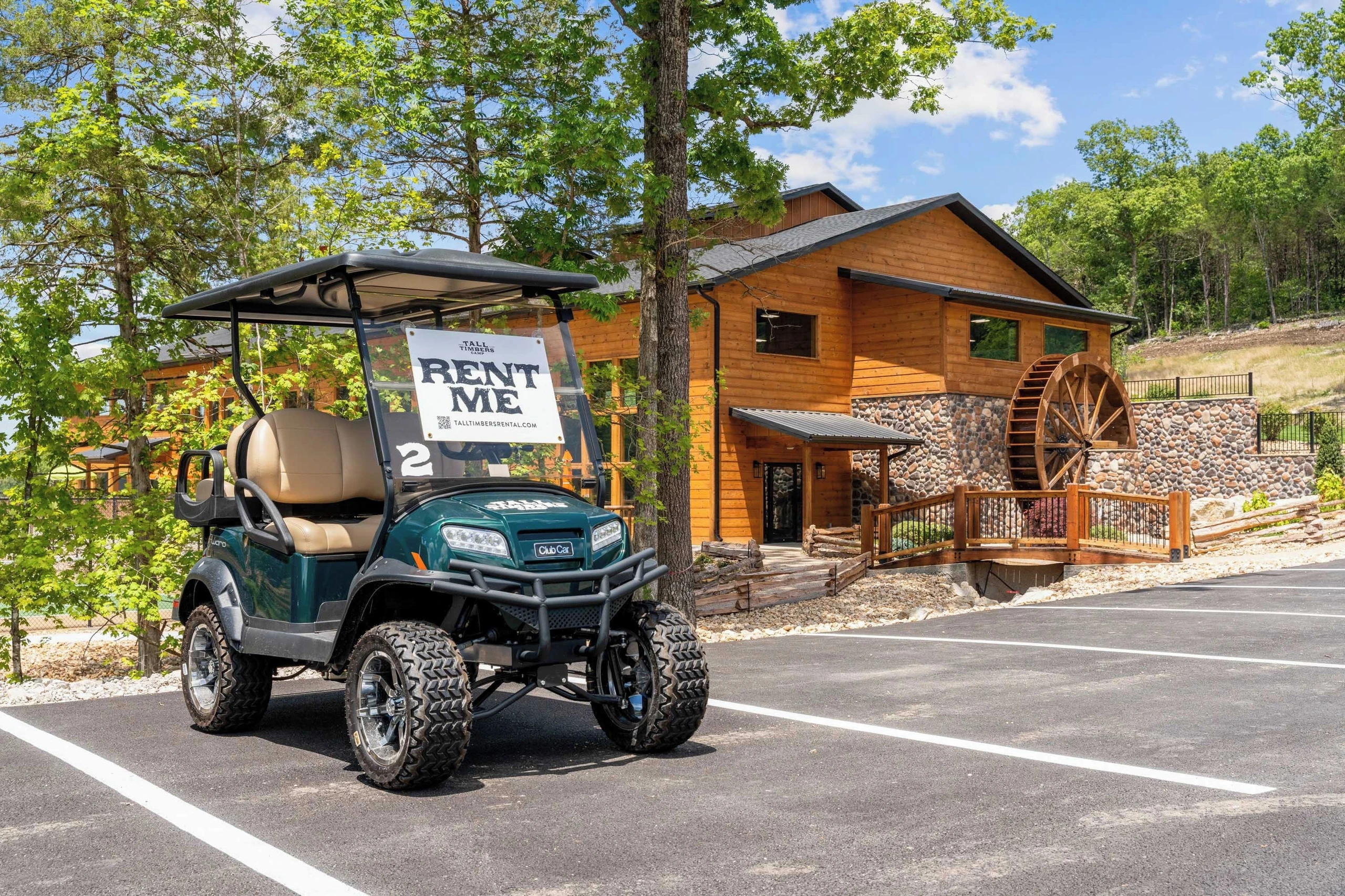 Many families enjoy renting a golf cart at Tall Timbers Camp to explore the many acres of the property.