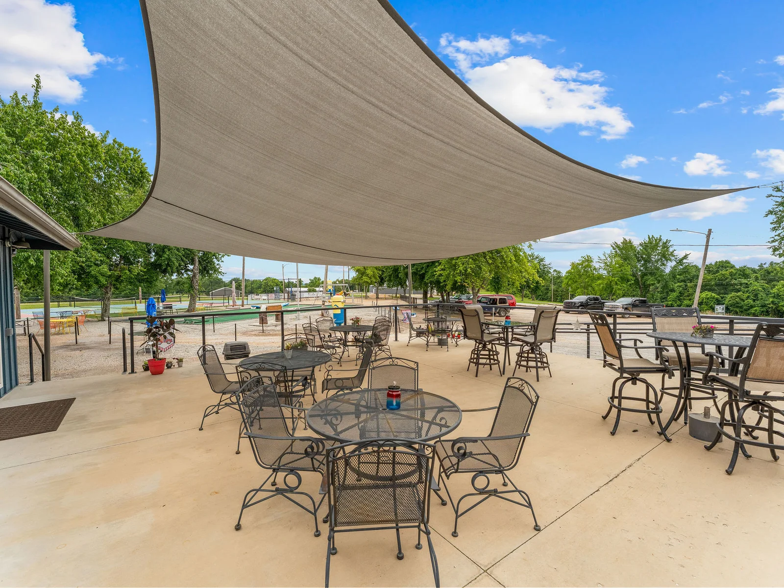 The outdoor patio and common area at Lost Woods Hideaway — a central gathering spot between the restaurant, the bar, and the lake.
