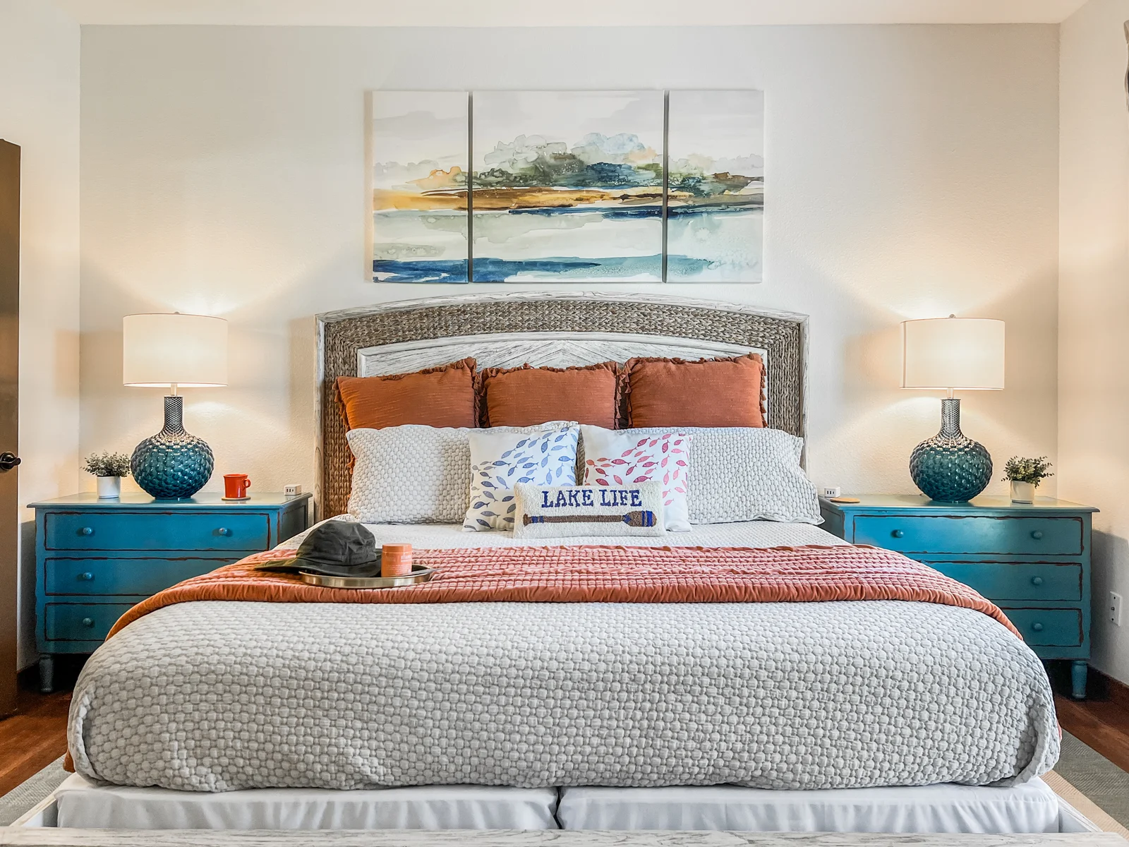 The main-level master bedroom is so serene, it's a perfect mix of cozy and "I'm on VACAY!"