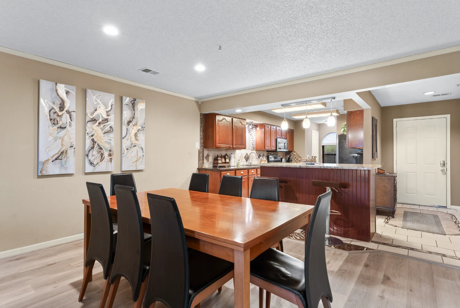 Dining area connects kitchen and living room for easy gatherings.