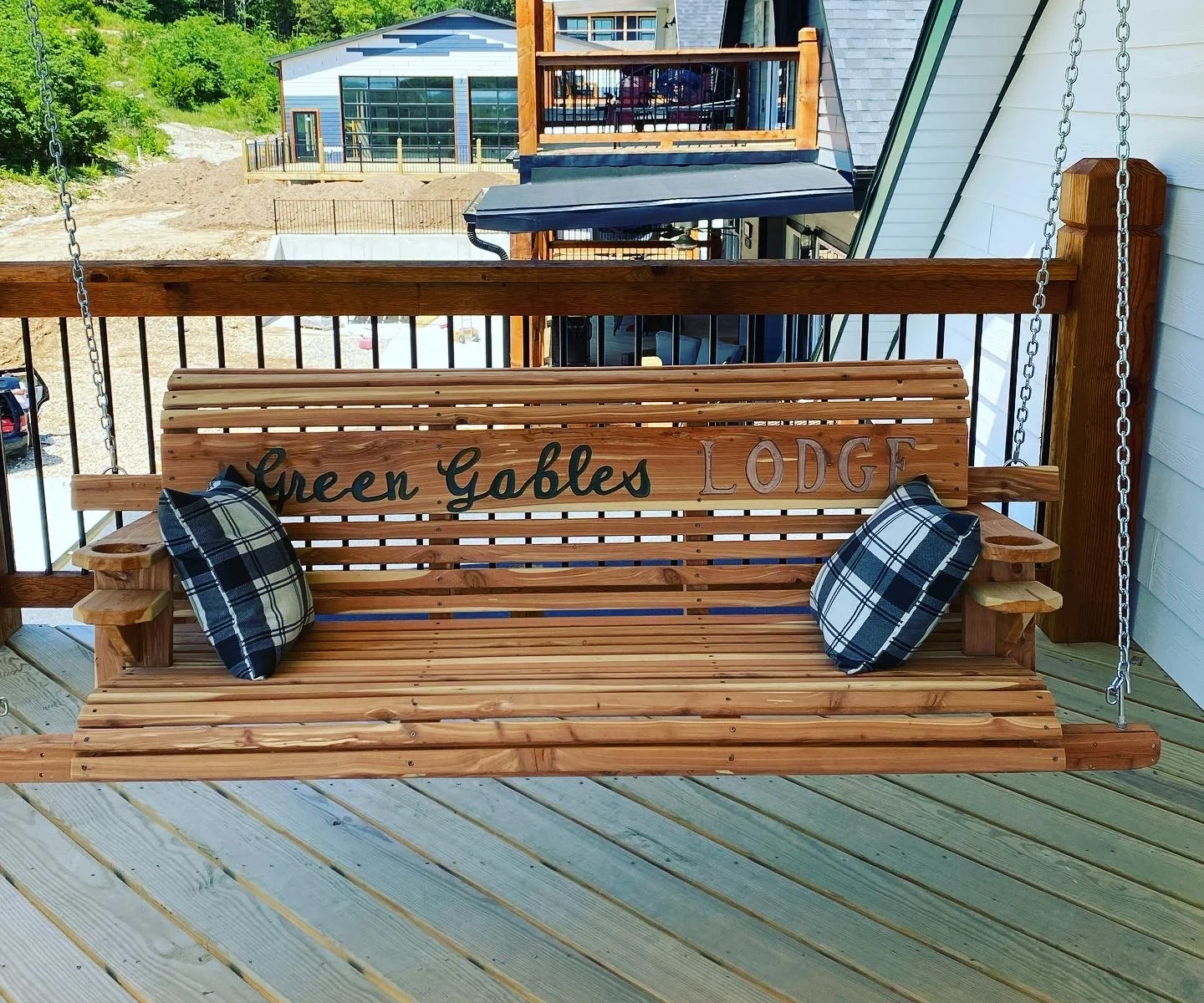 Private deck with custom cedar swing accessed through Bright River room.