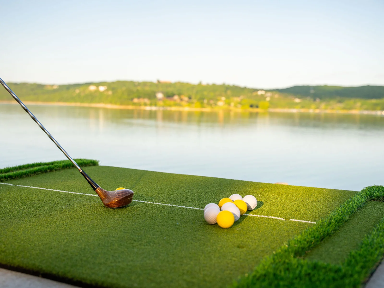 Practice your swing with lakefront views from the putting area designed for laid-back fun.
