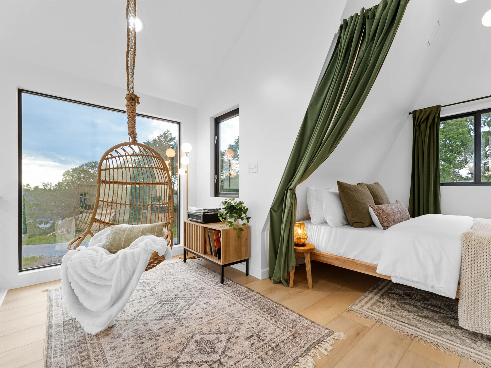 Cozy loft queen suite with velvet curtains & vinyl records for the night
