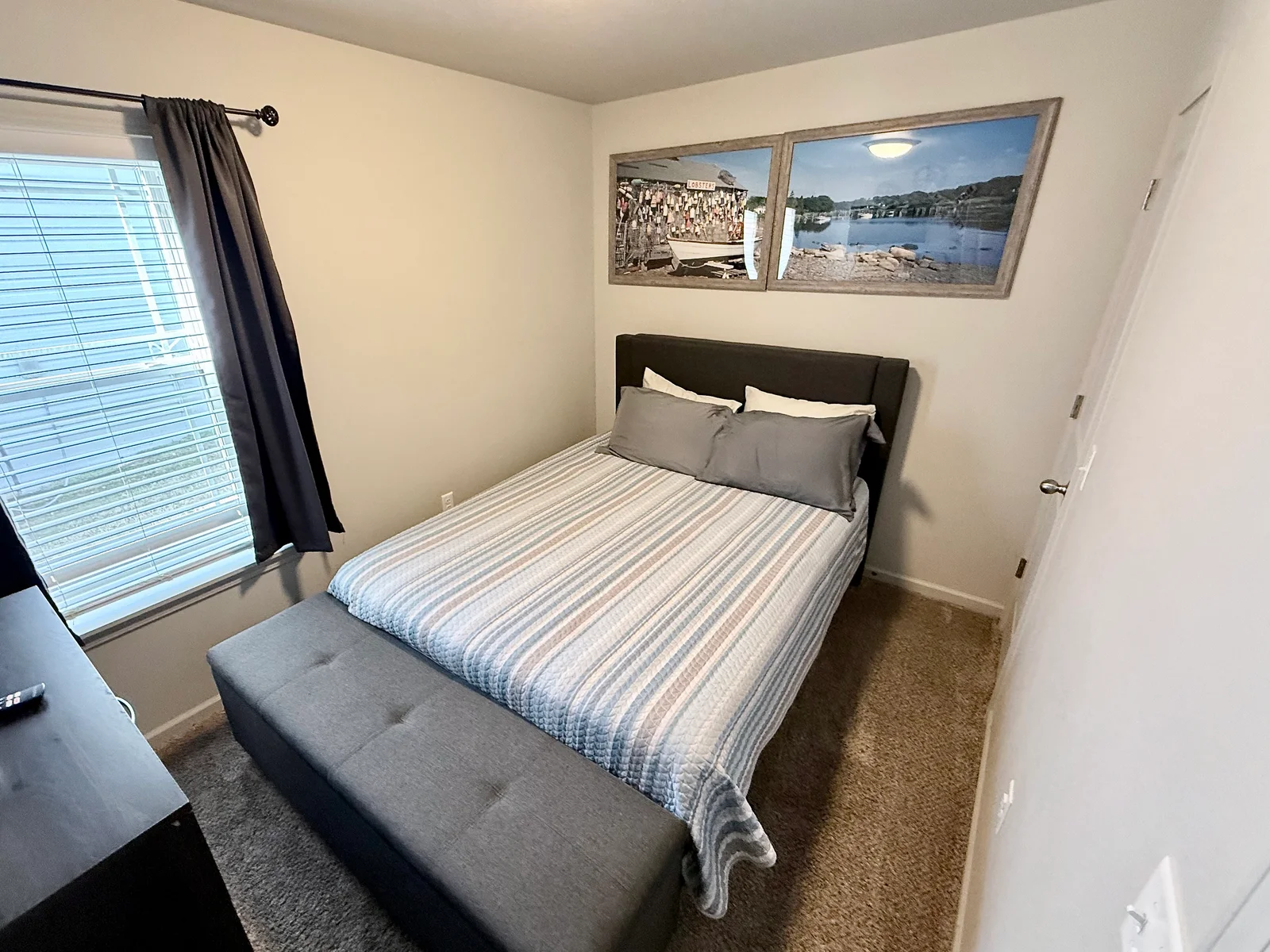 Bedroom 2 with Queen size bed and a place to sit at end of bed