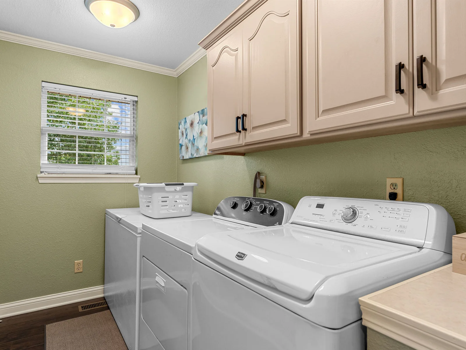 A full-size Maytag washer and dryer on the main floor — important for a week-long stay. The laundry room has a utility sink and plenty of shelf space. There's also a full size freezer for your catch of the day.