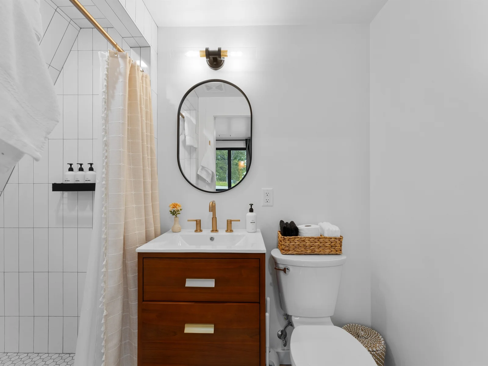 Clean finishes and a minimalist design create a relaxing bathroom experience.