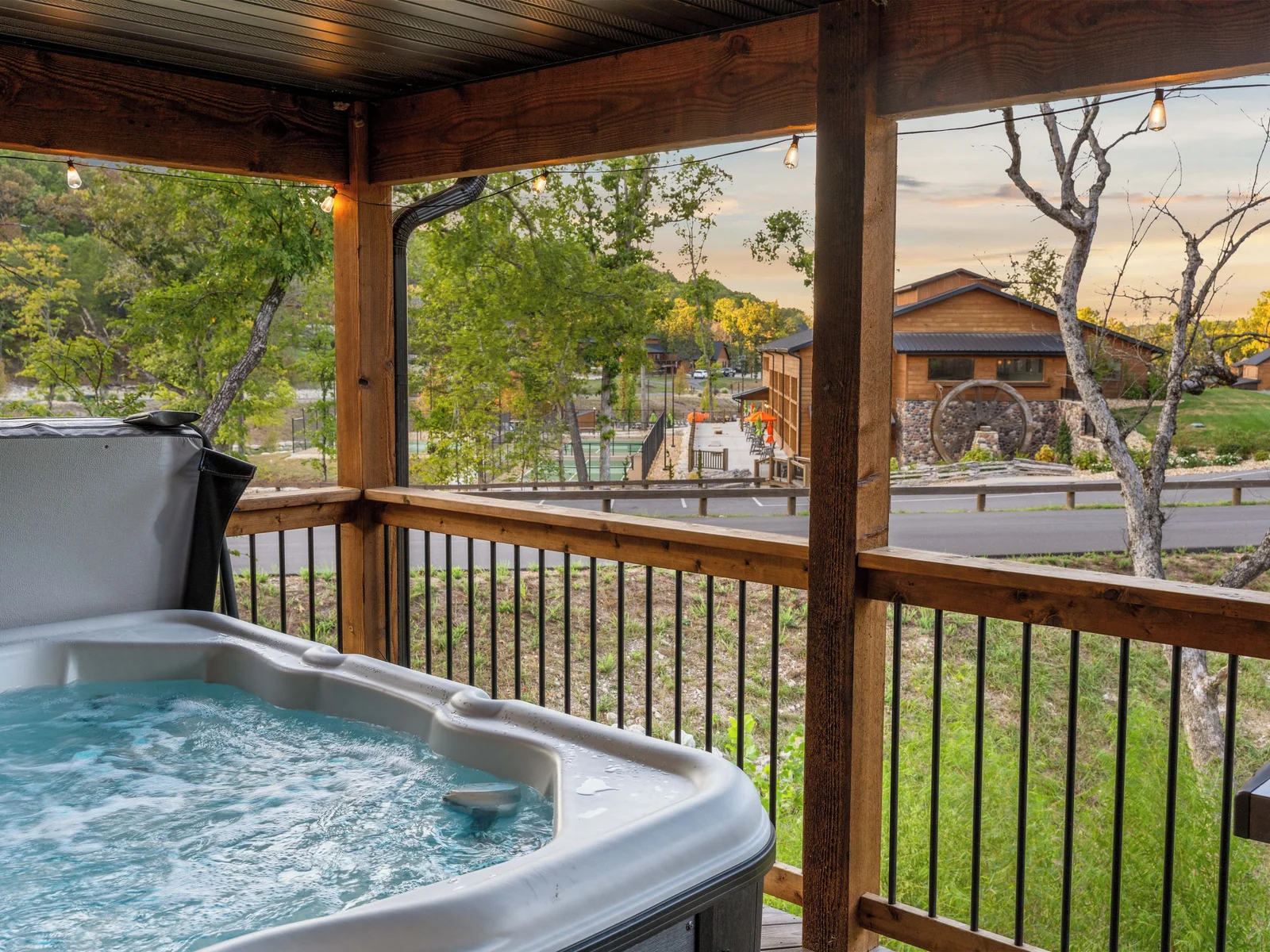 Hot tub with view of water wheel spinning on the indoor pool building
