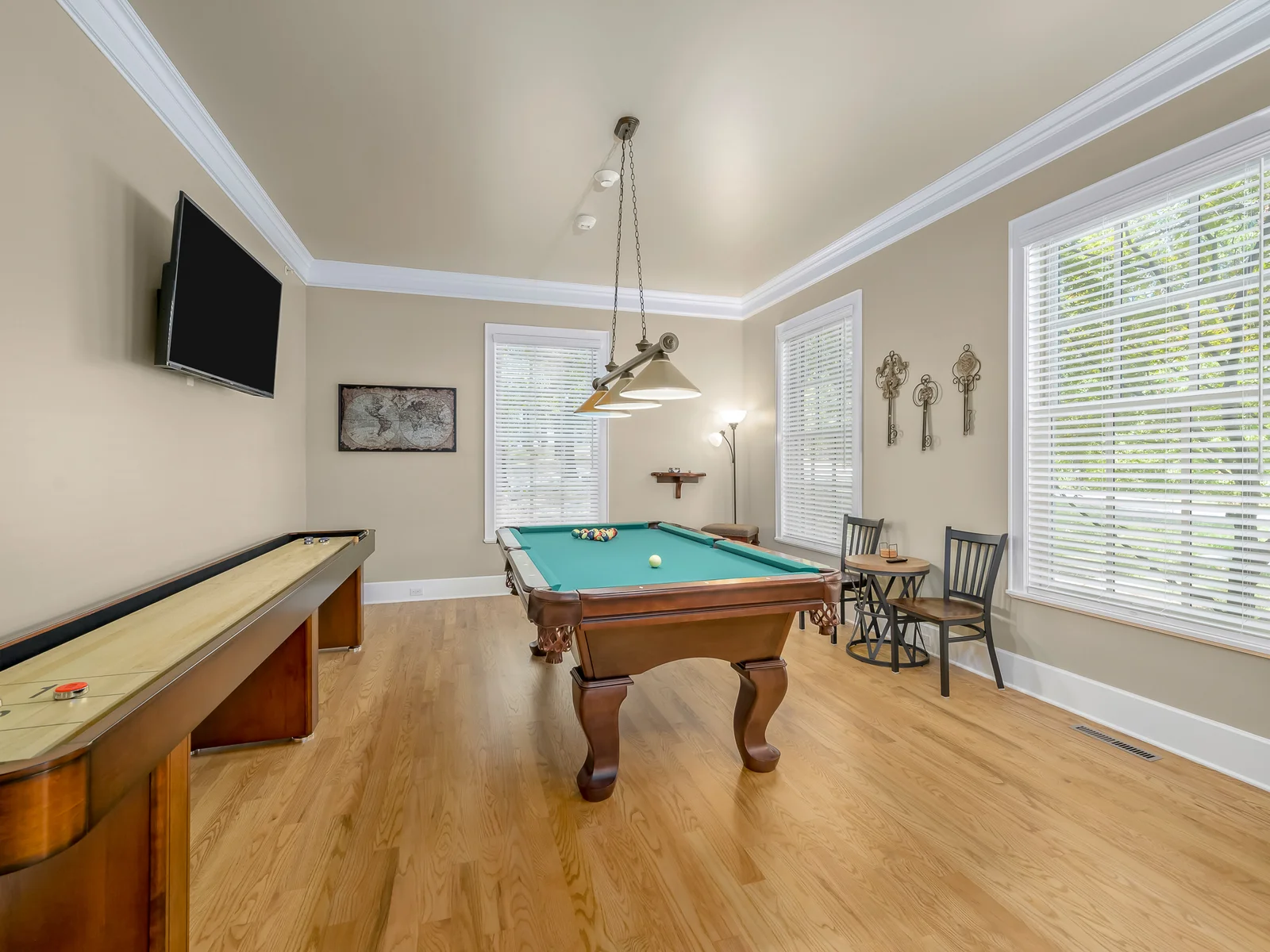 Billiards room with 9 foot shuffleboard table