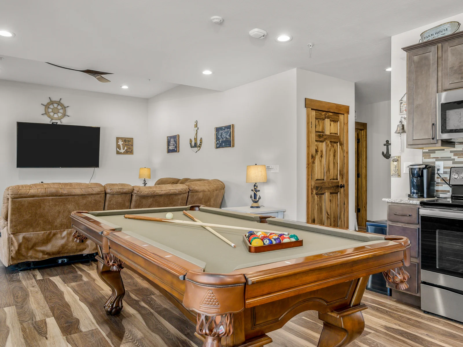 Game area with pool table and 70" smart TV