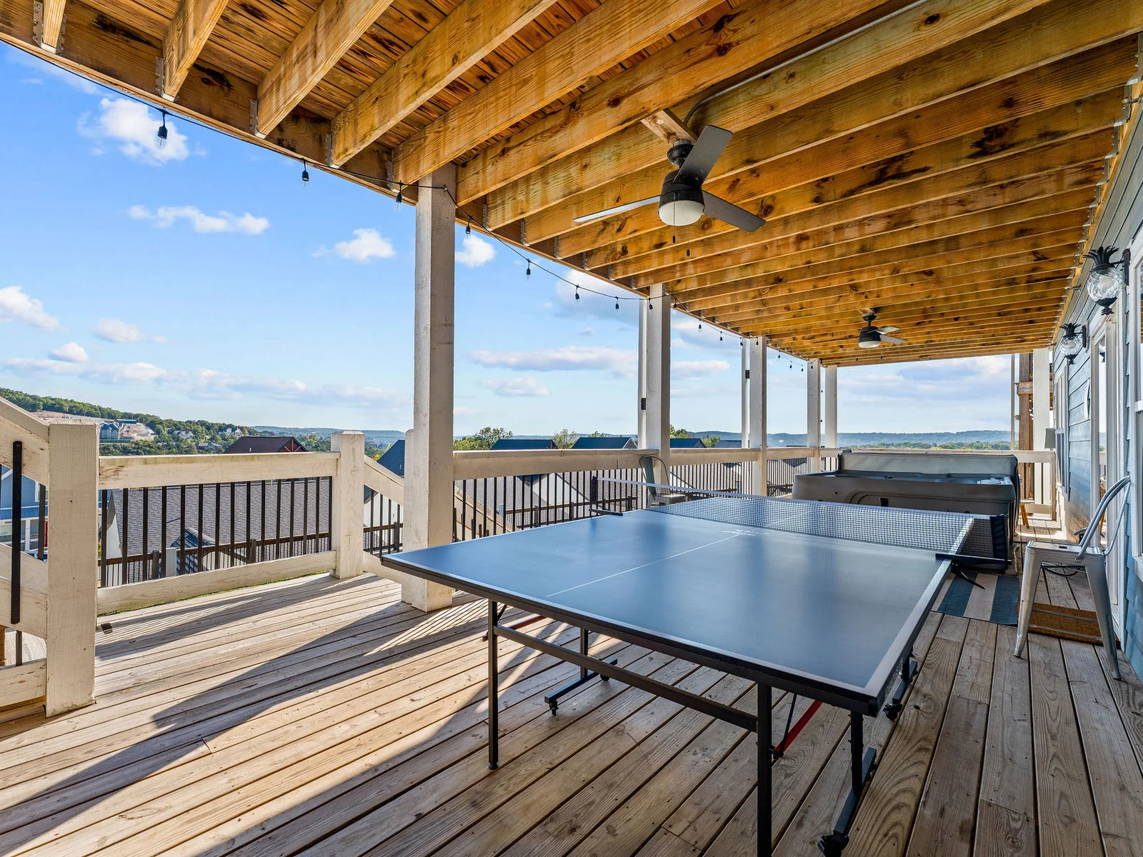 Outdoor ping pong table next to the hot tub!