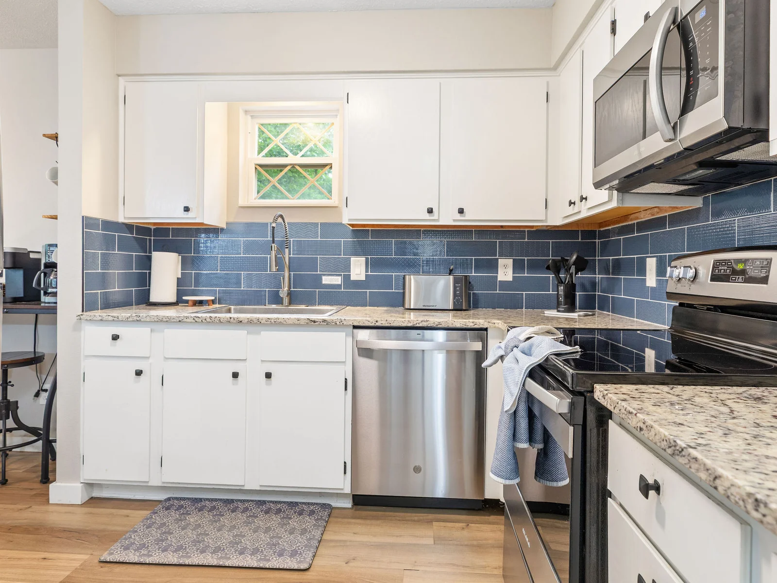 Kitchen w/ fridge, dishwasher, and oven - stocked with all the cooking essentials