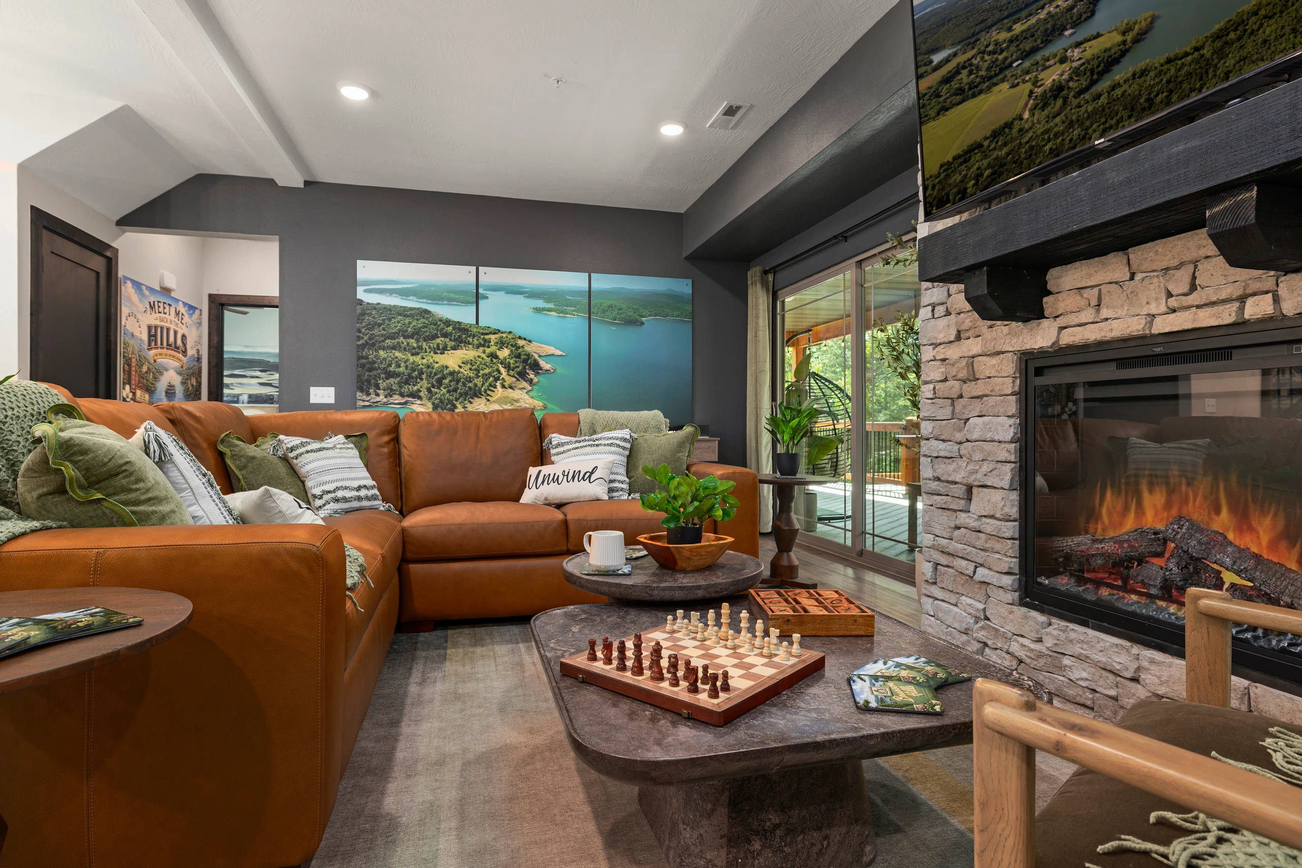 Sink into the leather sectional under the Table Rock Lake mural above the mantel.
